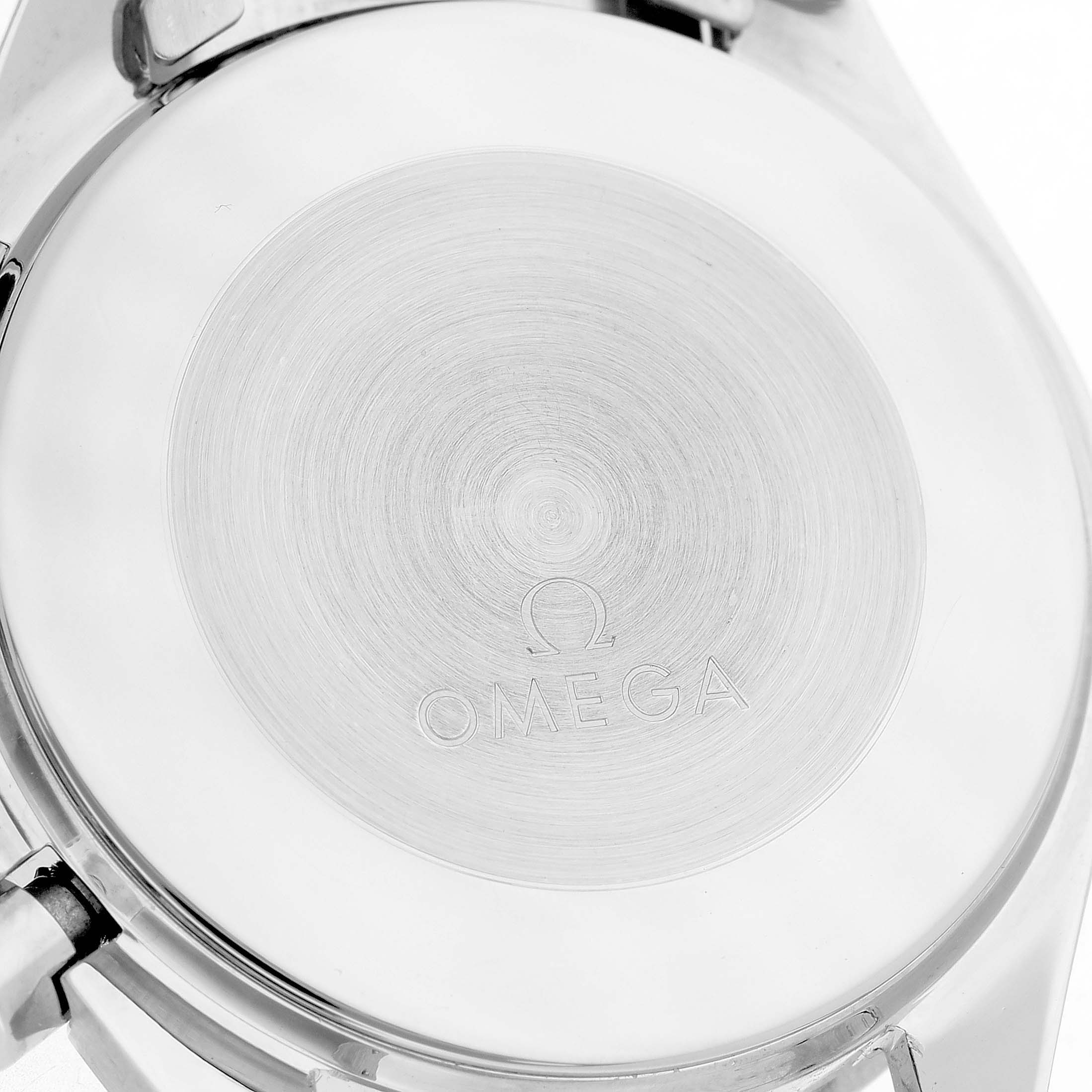 The image shows the back case of an Omega Speedmaster 3510.50.00 Men's Stainless Steel Black Dial watch from a top-down angle, displaying the Omega logo.