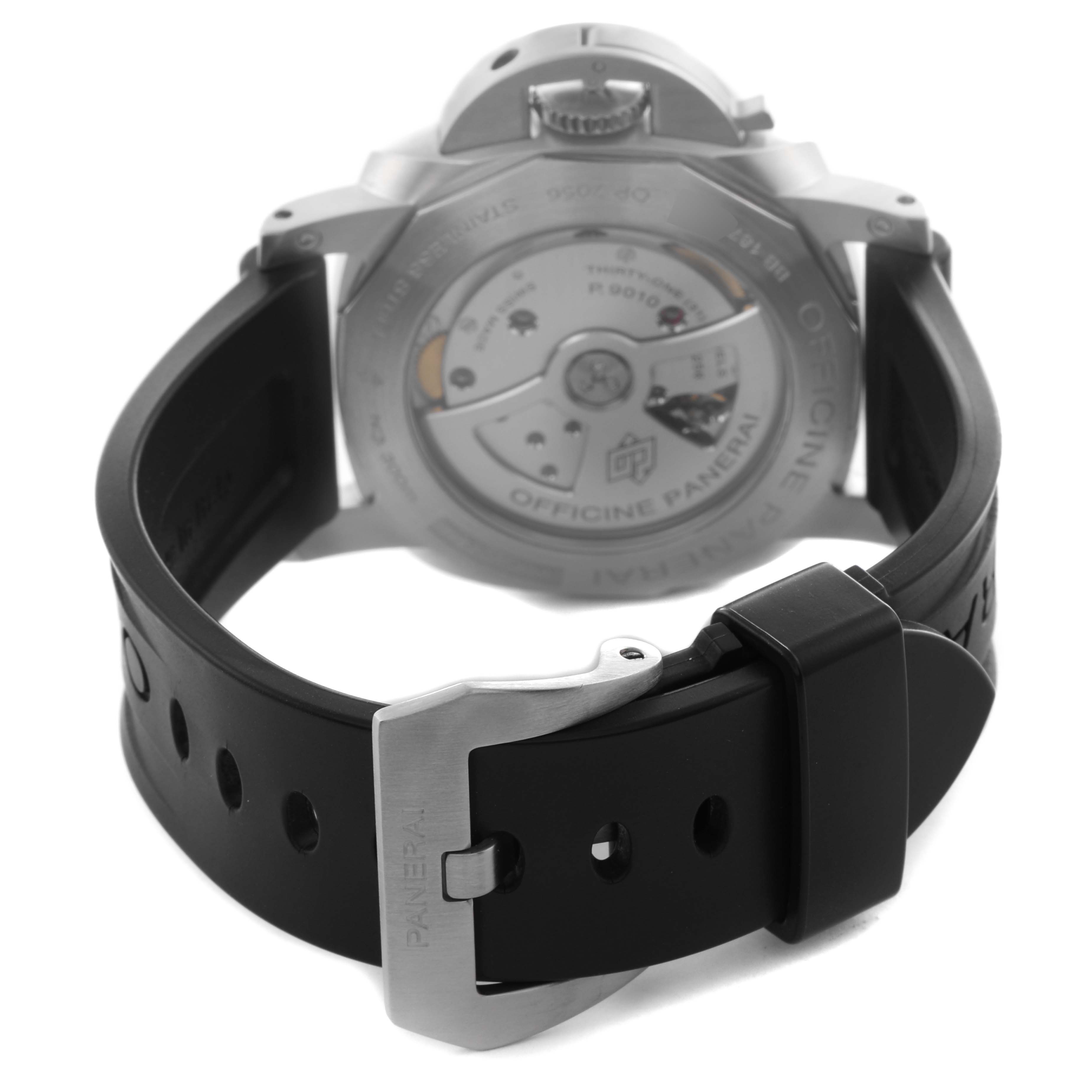 The image shows the back view of a Panerai Luminor PAM01312 Men's Stainless Steel Black Dial PAM01312 Men's Stainless Steel Black Dial watch, highlighting its movement and black rubber strap with buckle.