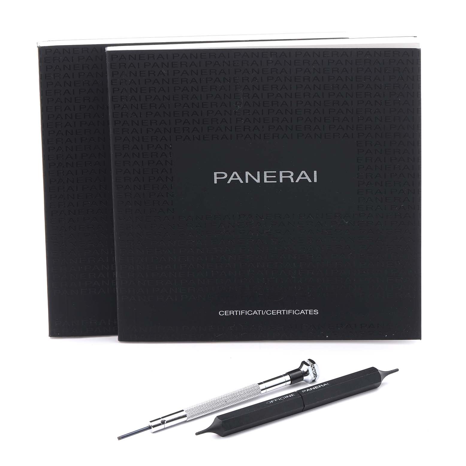 The image shows a top view of Panerai Luminor PAM01312 Men's Stainless Steel Black Dial PAM01312 Men's Stainless Steel Black Dial accessories, including two tools and two manuals.