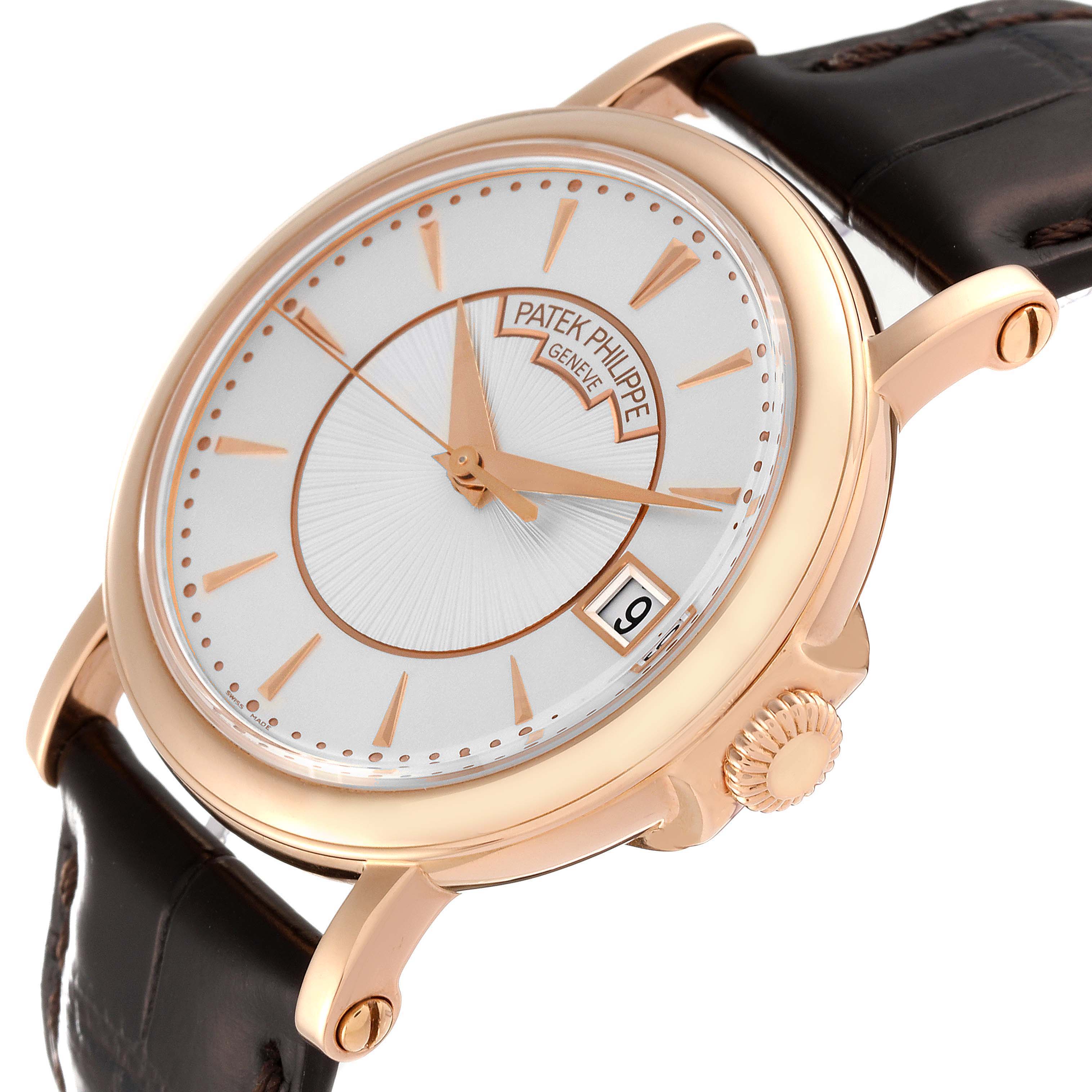 The image shows a Patek Philippe Calatrava 5153R-001 Men's Rose Gold Silver Dial 5153R-001 Men's Rose Gold Silver Dial watch from a slightly angled side view, featuring the dial, crown, and part of the leather strap.