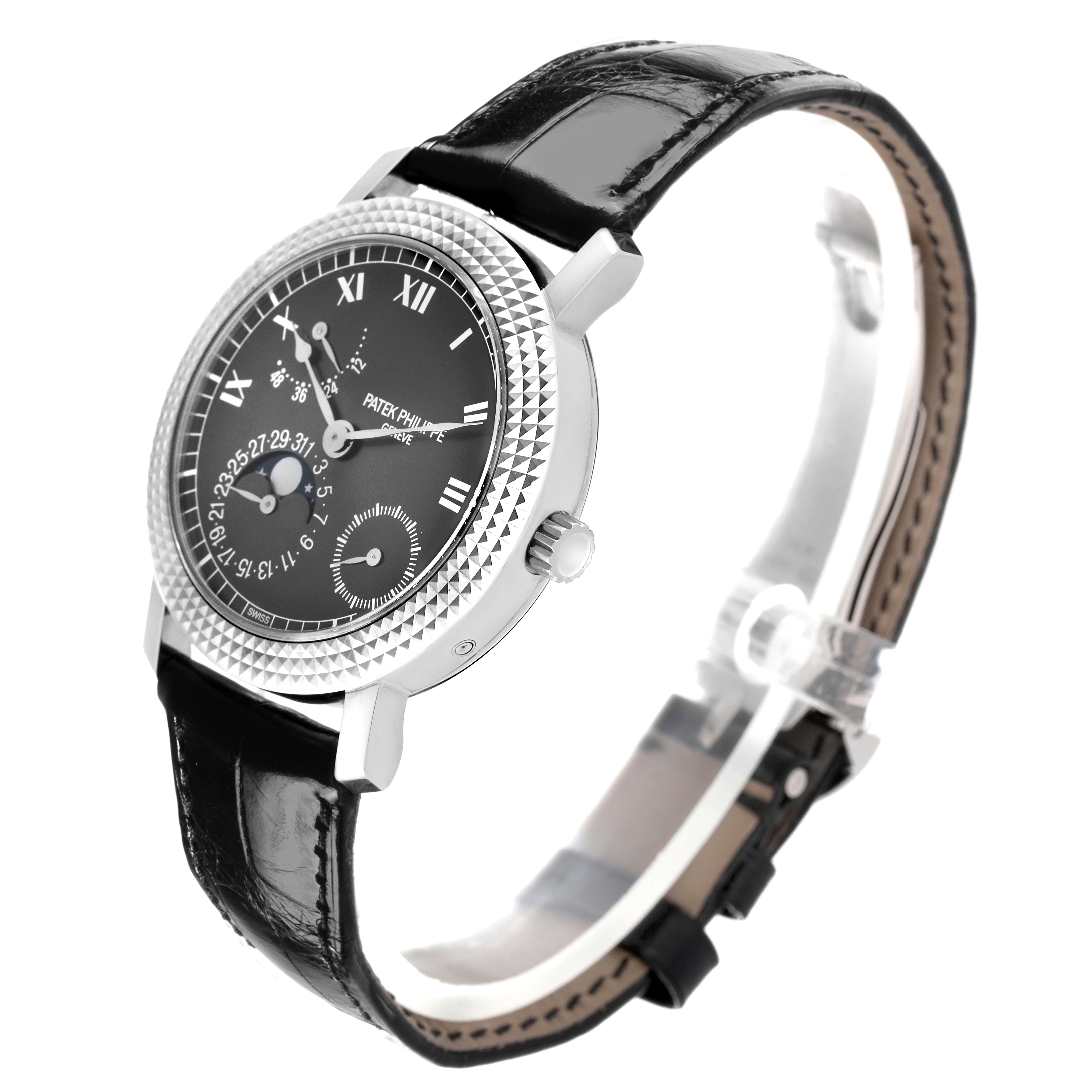 The Patek Philippe Calatrava 5057G-010 Men's White Gold Grey Dial watch is shown at a three-quarter angle, highlighting the dial, bezel, case, and leather strap.