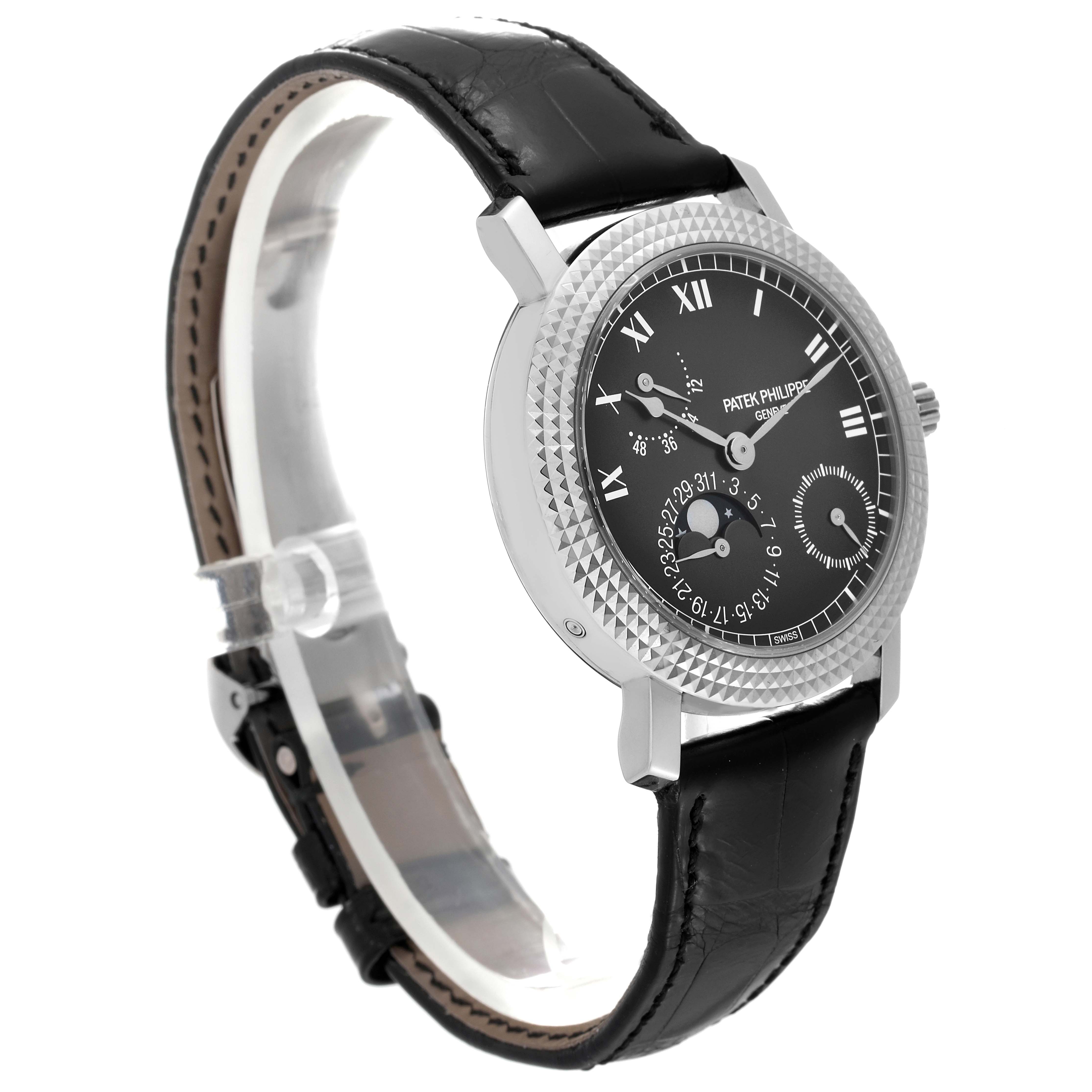 This image shows a side-front angle of the Patek Philippe Calatrava 5057G-010 Men's White Gold Grey Dial 5057G-010 Men's White Gold Grey Dial watch, highlighting its face, strap, and bezel with a leather band.