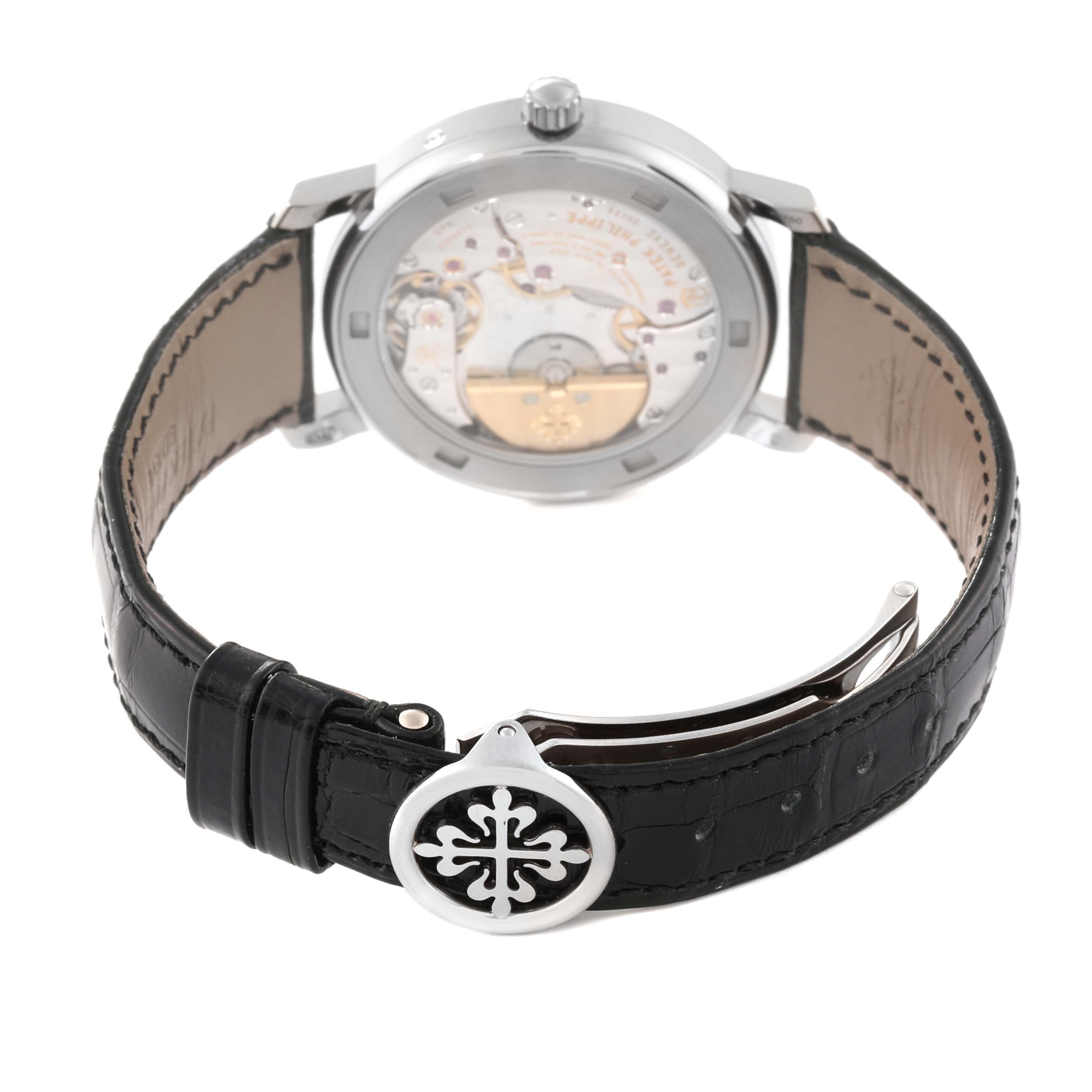 The image shows the back view of the Patek Philippe Calatrava 5057G-010 Men's White Gold Grey Dial 5057G-010 Men's White Gold Grey Dial watch, highlighting the leather strap and buckle.