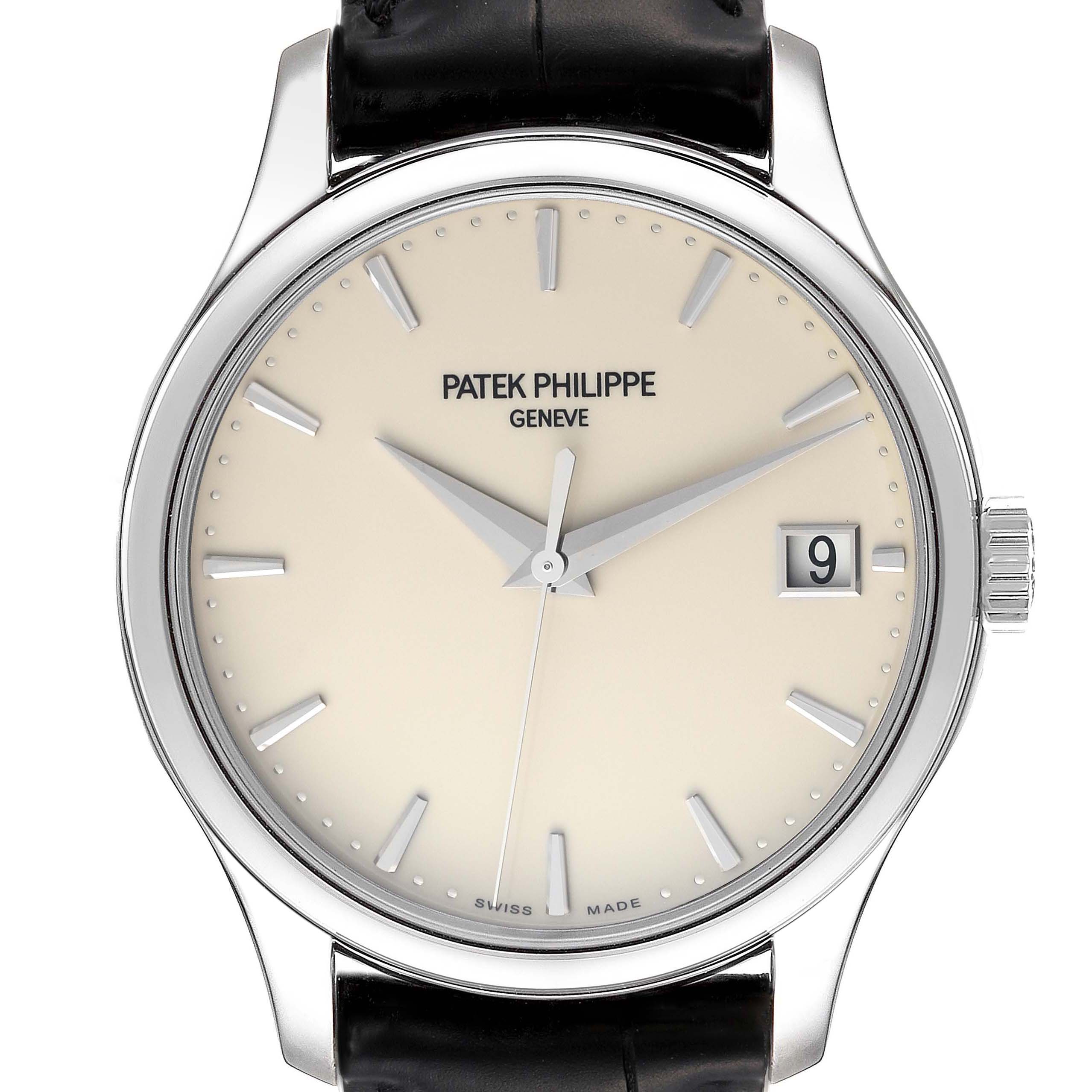 This is a front view of a Patek Philippe Calatrava 5227G-001 Men's White Gold Beige Dial 5227G-001 Men's White Gold Beige Dial watch, showing its dial, hands, date window, and part of the strap.