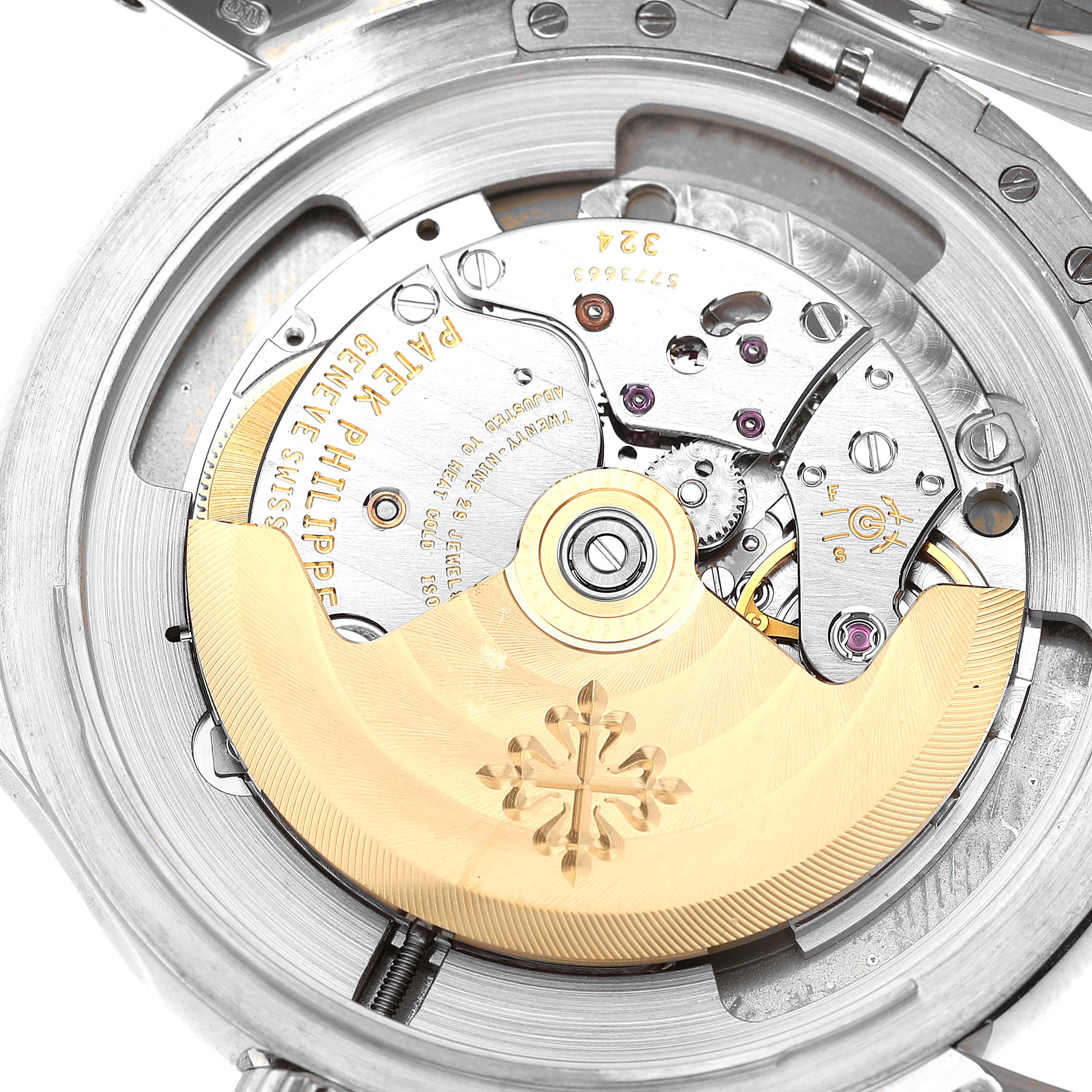 The image shows the internal mechanical movement of a Calatrava model by Patek Philippe from a rear angle.