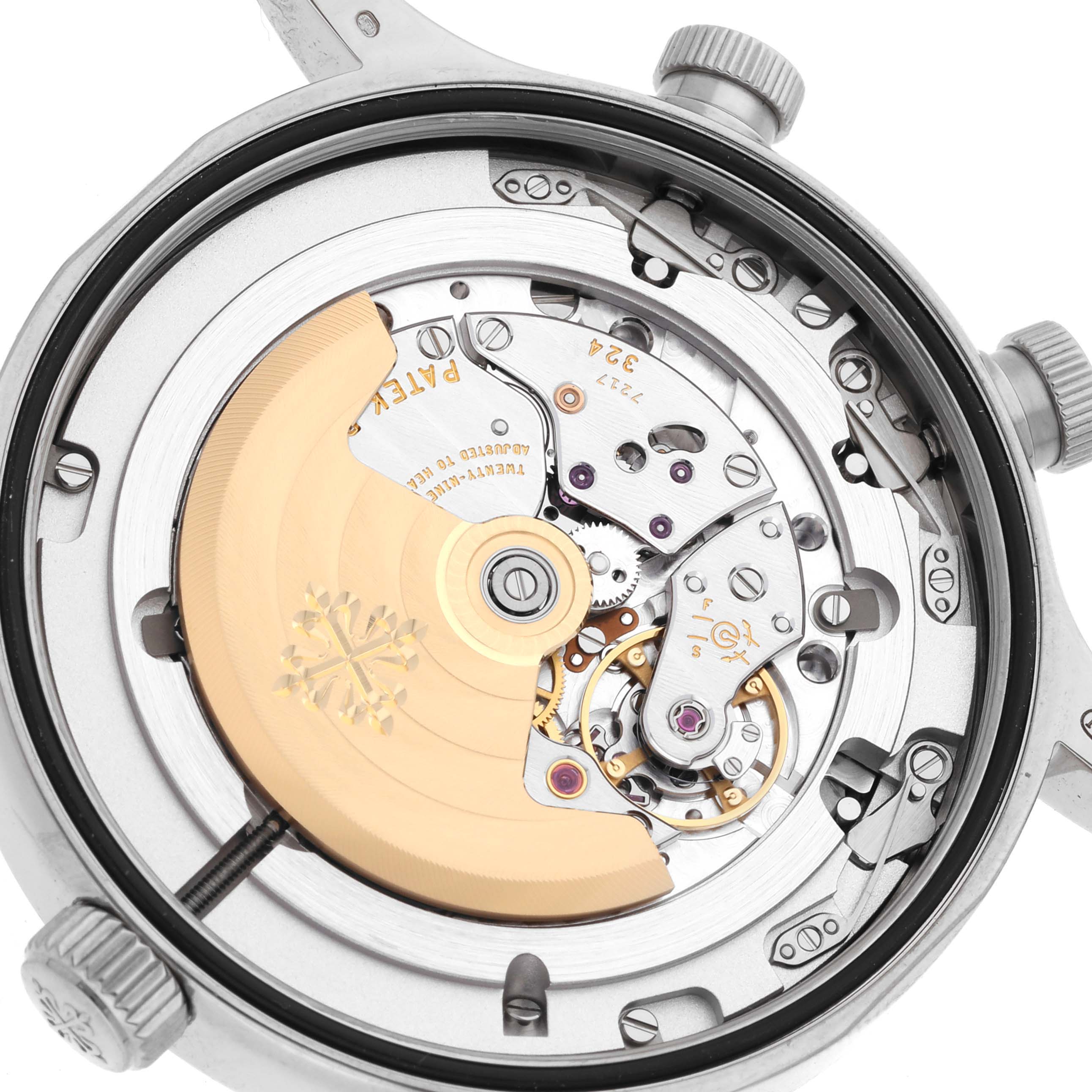 The image shows a detailed view of the movement and inner mechanism of a Patek Philippe Calatrava 5524G-001 Men's White Gold Black Dial 5524G-001 Men's White Gold Black Dial watch from the rear angle.