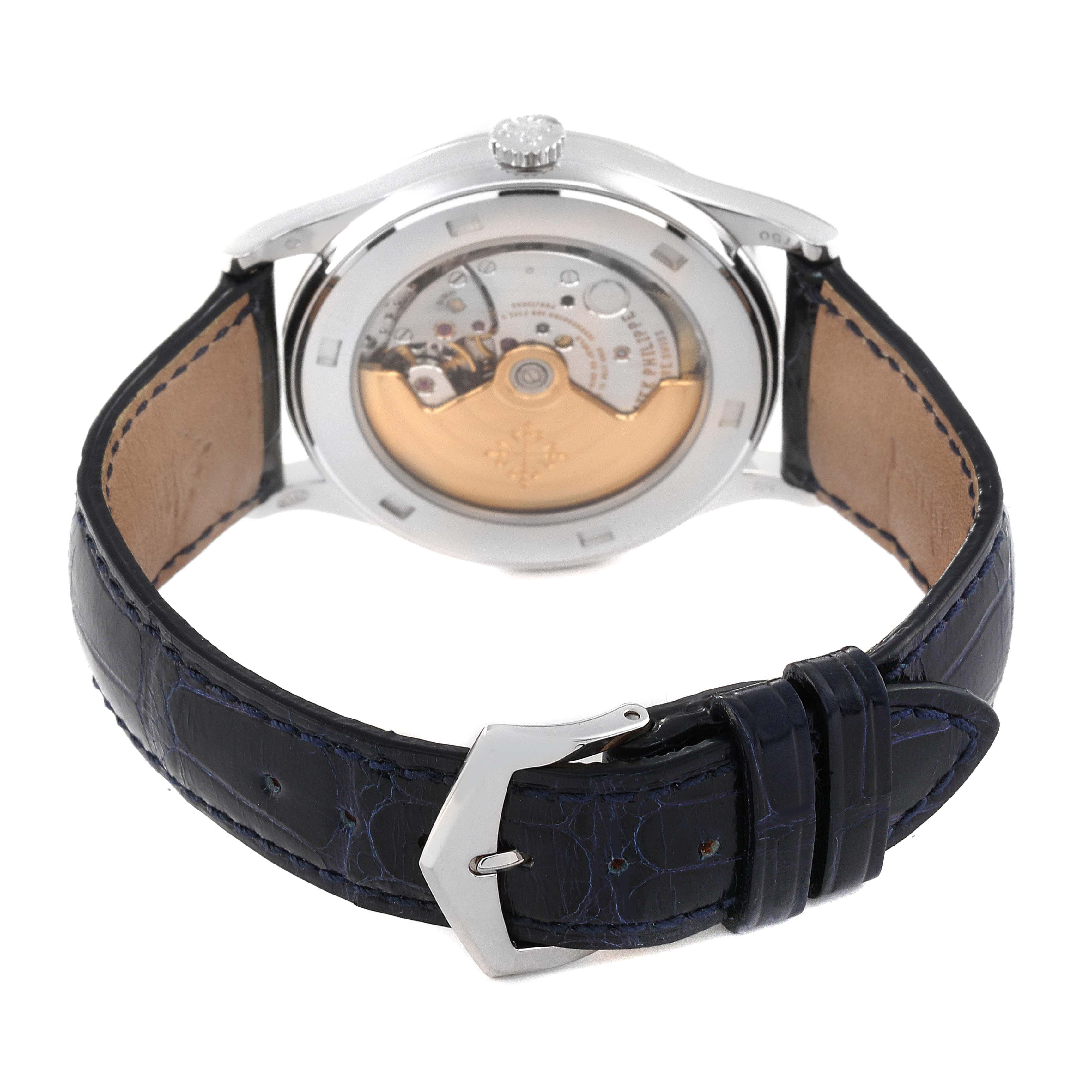 The image shows the back view of a Patek Philippe Calatrava 5296G Men
s White Gold Silver Dial 5296G Men
s White Gold Silver Dial watch, displaying the movement and leather strap with buckle.