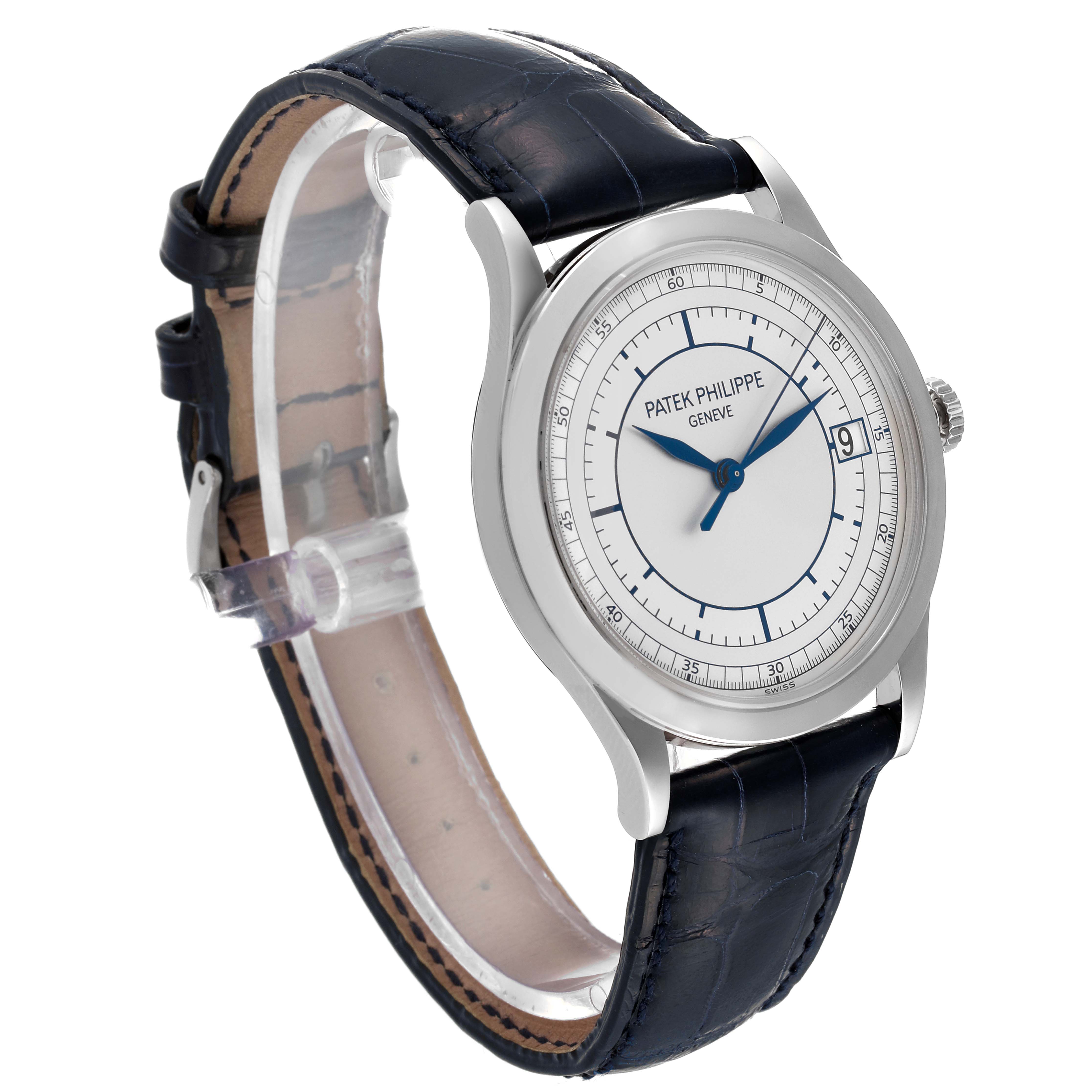 The Calatrava by Patek Philippe is shown at a front-side angle, displaying its face, case, and leather strap.