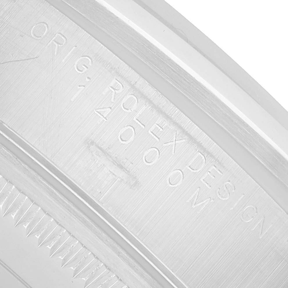 The image shows an engraved part of the Rolex Air-King 14000 Men's Stainless Steel Blue Dial, focusing on the inner bezel inscription.