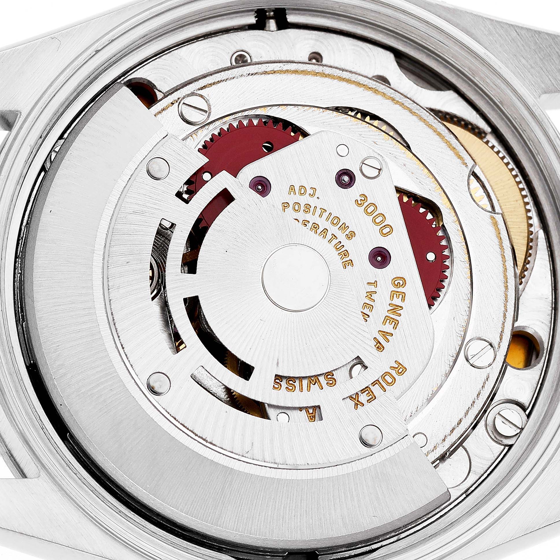 The image shows the Air-King Rolex movement from the back, highlighting the rotor and internal gears.