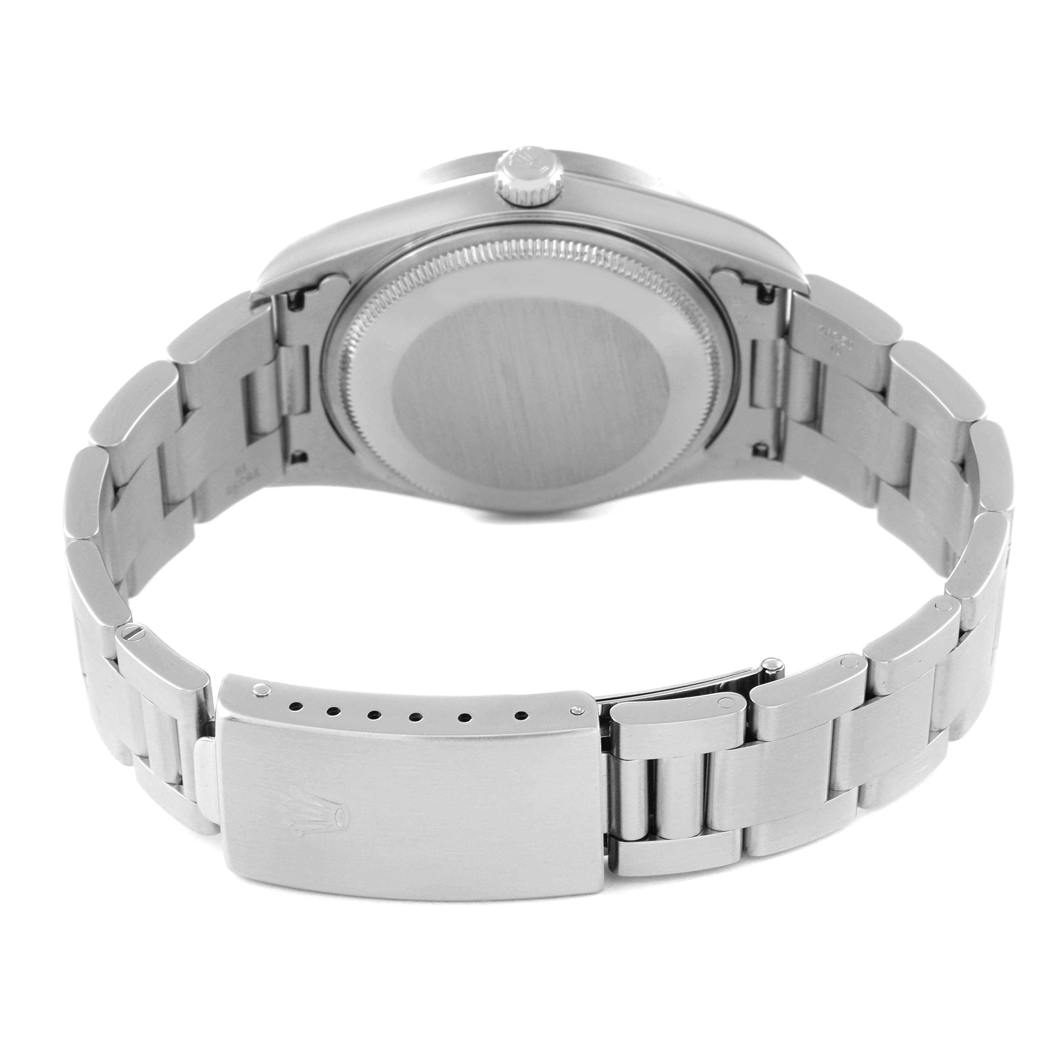 The Rolex Air-King 14010M Men's Stainless Steel Silver Dial 14010M Men's Stainless Steel Silver Dial watch is shown from the back, displaying the case back, bracelet, and clasp.
