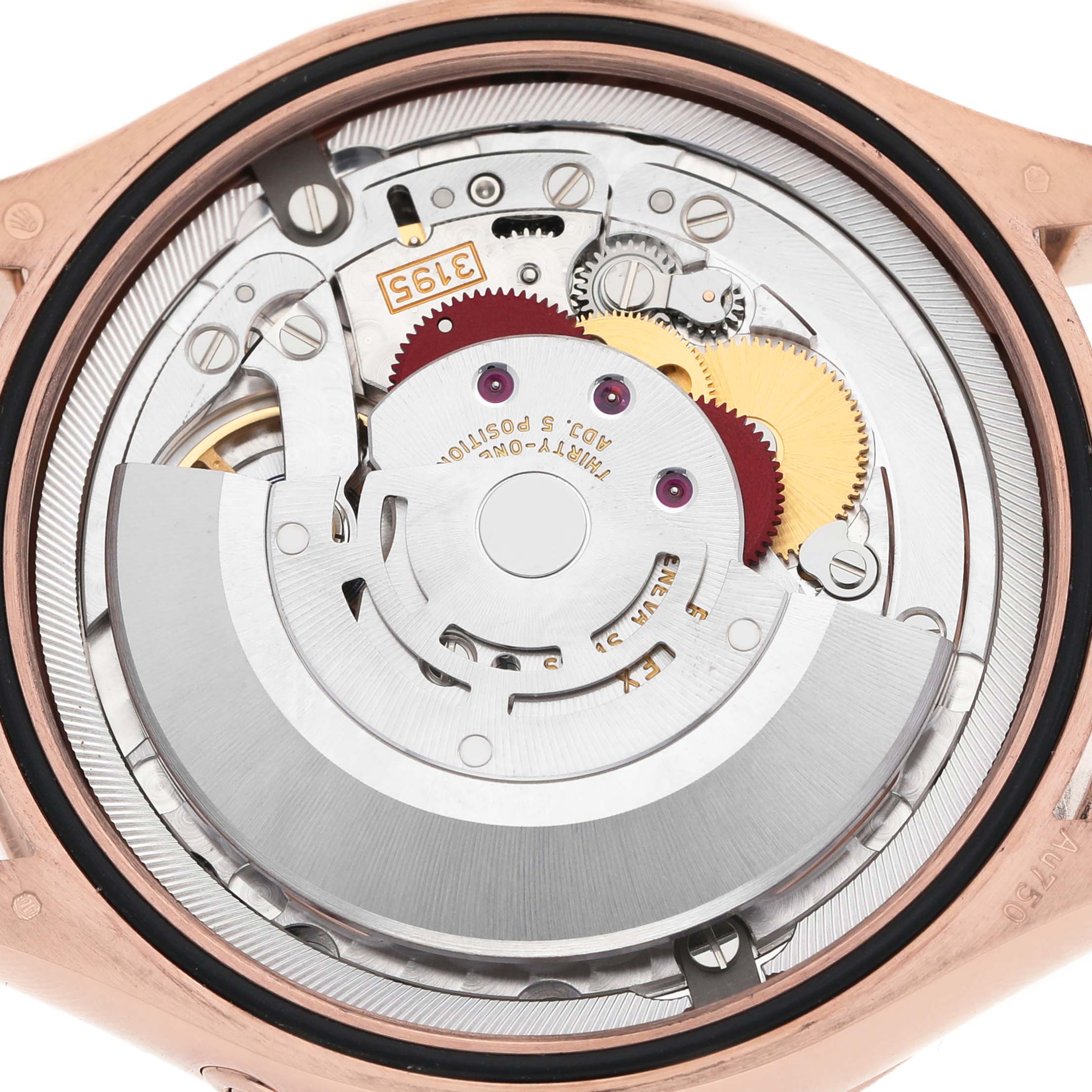 The image shows the movement of a Rolex Cellini 50535 Men's Rose Gold White Dial watch, viewed from the back, highlighting gears and mechanical components.