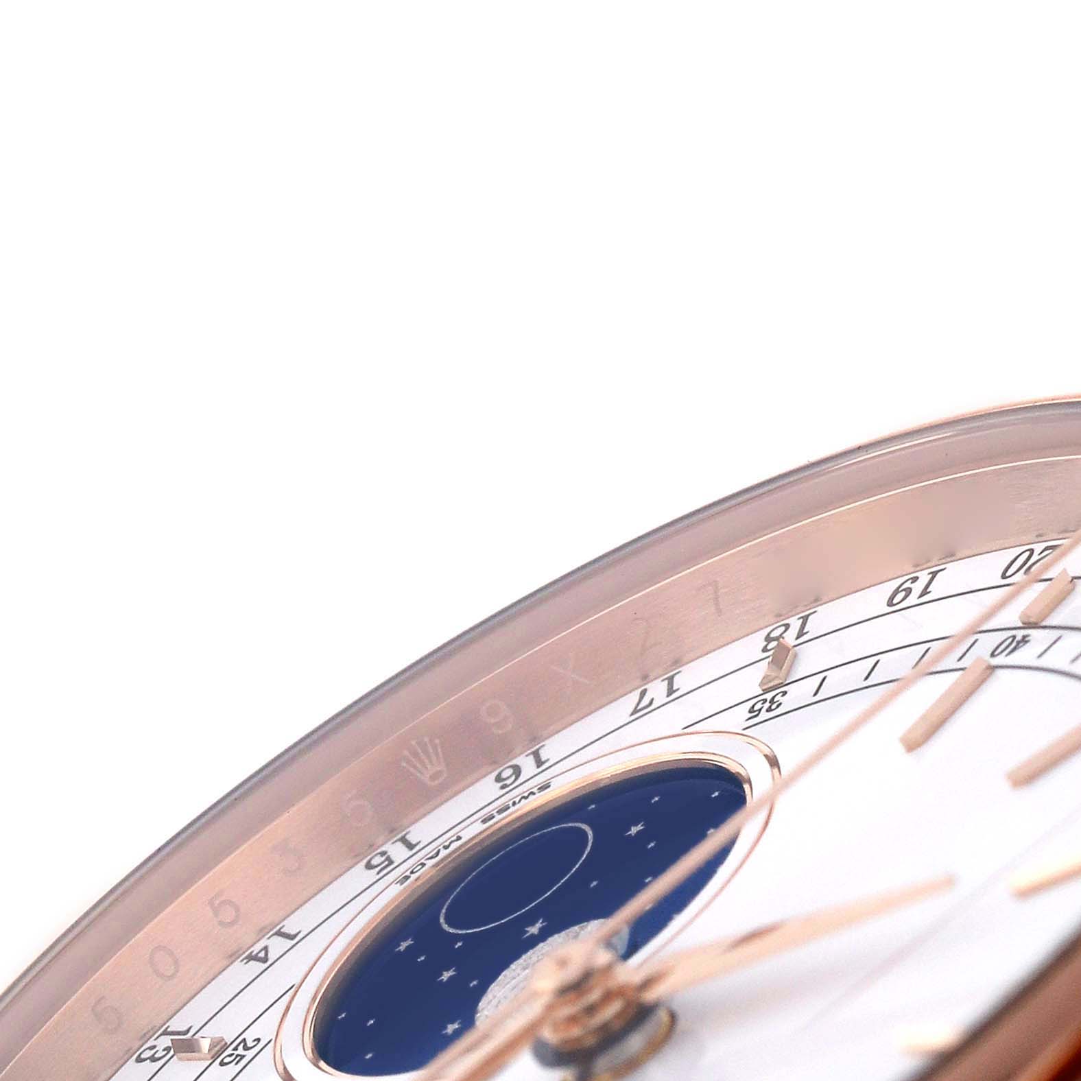 The image shows a close-up of the edge and dial details of a Rolex Cellini 50535 Men's Rose Gold White Dial, featuring a moon phase and numerals.