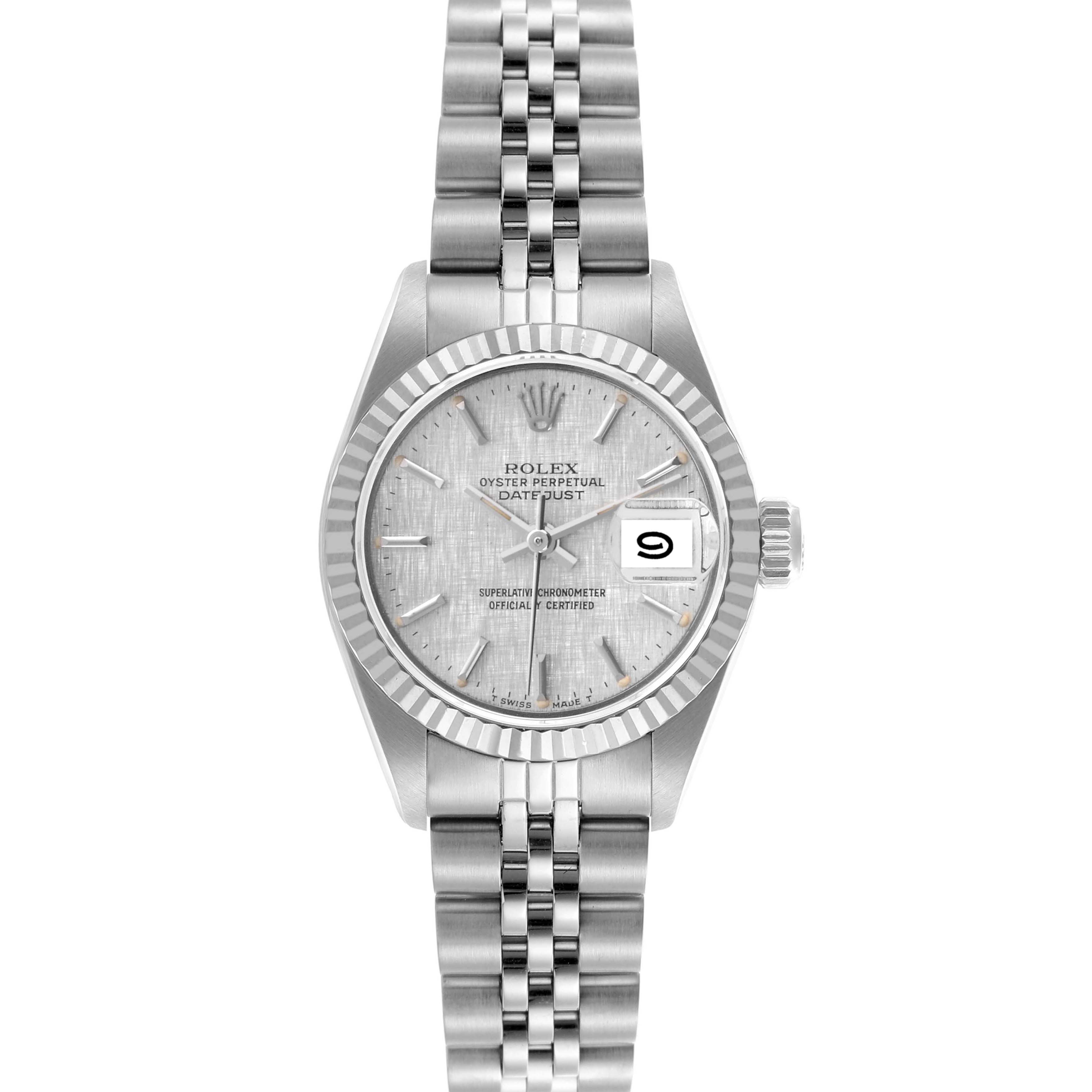 The Rolex Date 69174 Women's Stainless Steel Silver Dial 69174 Women's Stainless Steel Silver Dial model is shown from a top-down angle, displaying its silver dial, fluted bezel, and Jubilee bracelet.