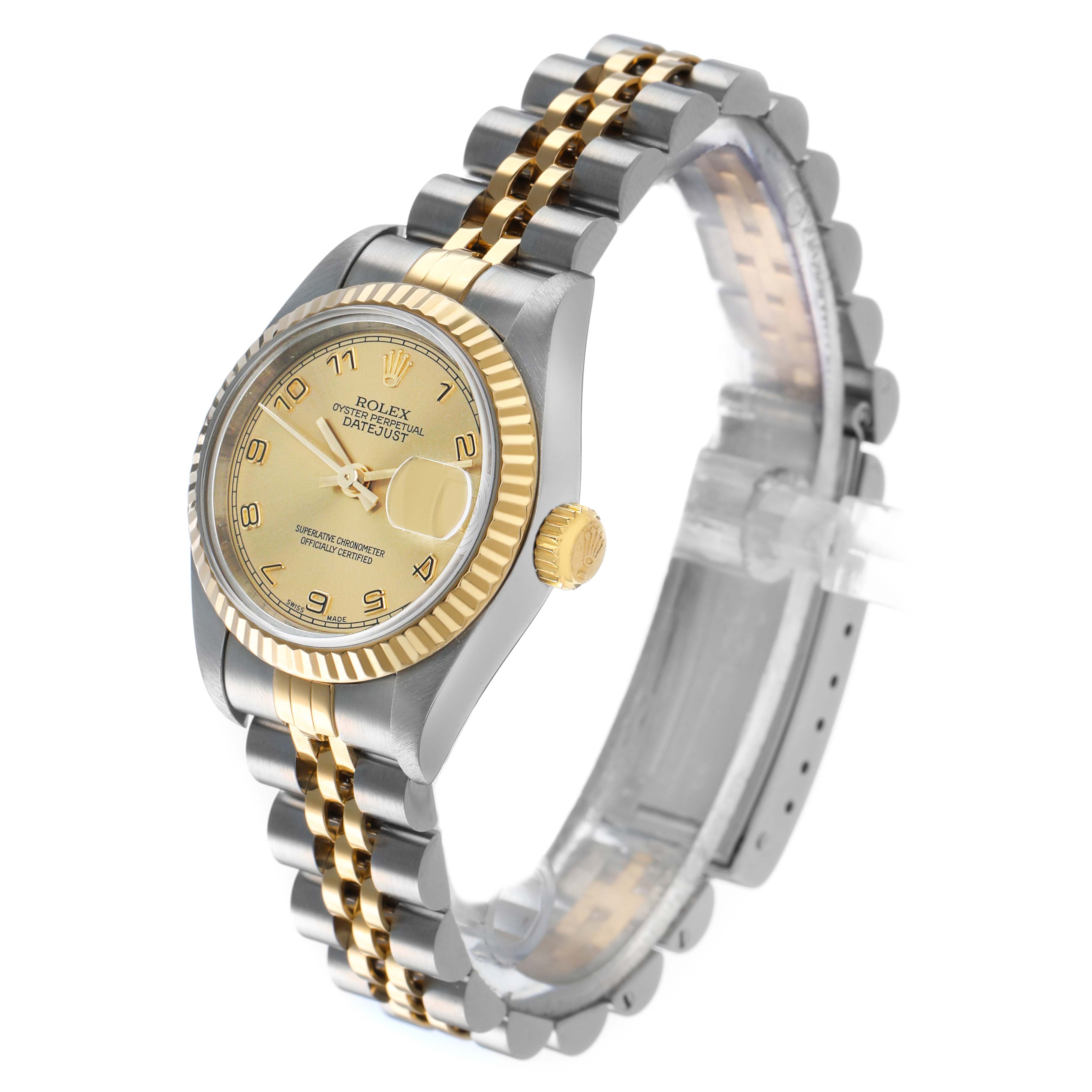 The Rolex Datejust 79173 Women's Steel and Gold (two tone) Champagne Dial watch is shown at a three-quarter angle, displaying the gold and silver bracelet, fluted bezel, and crown.