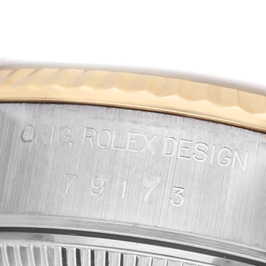 The image shows the side profile of a Rolex Datejust 79173 Women's Steel and Gold (two tone) Champagne Dial, highlighting the "ORIG. ROLEX DESIGN" engraving and model number 79173.