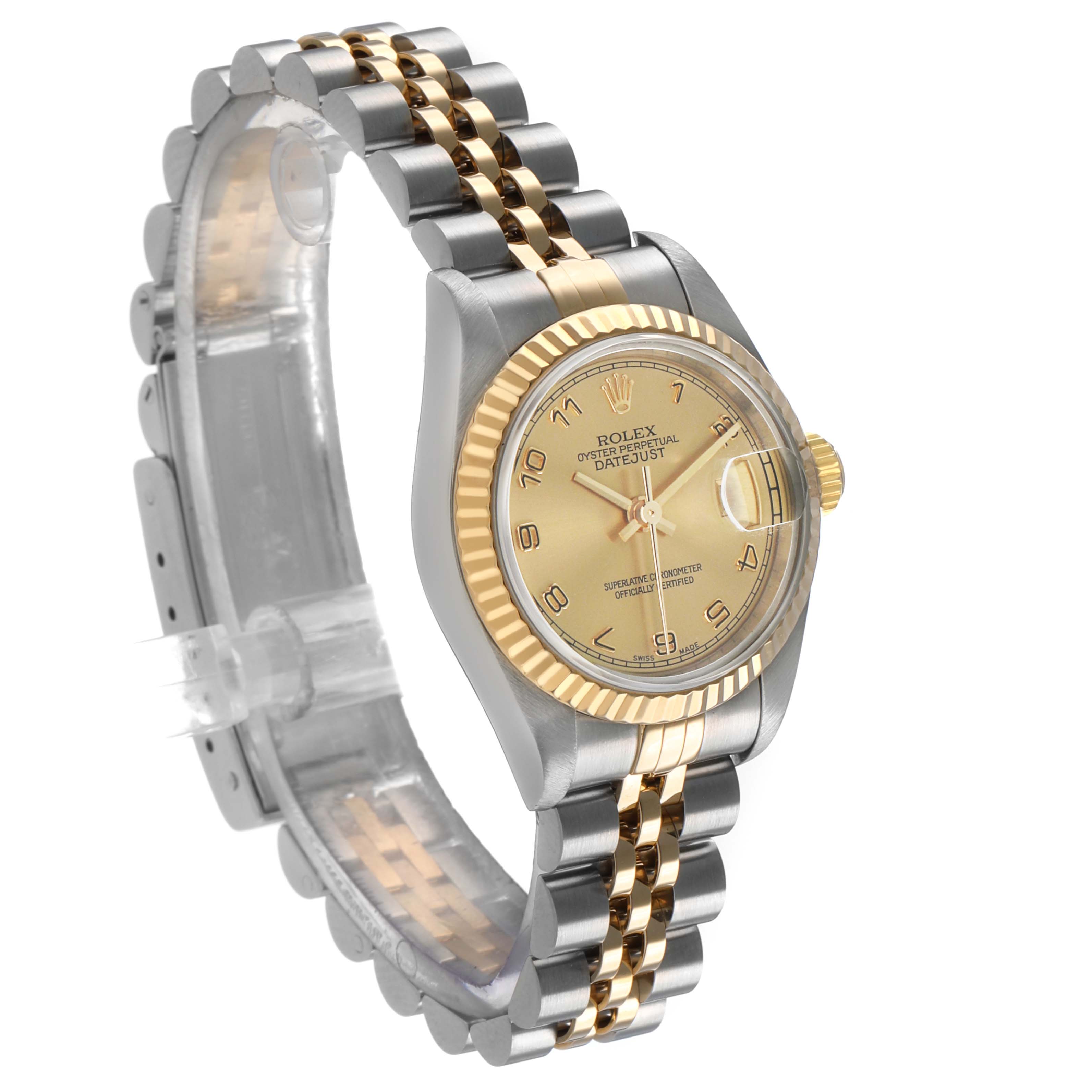 The Rolex Datejust 79173 Women's Steel and Gold (two tone) Champagne Dial watch is shown at a three-quarter angle, displaying the face, bezel, and bracelet.