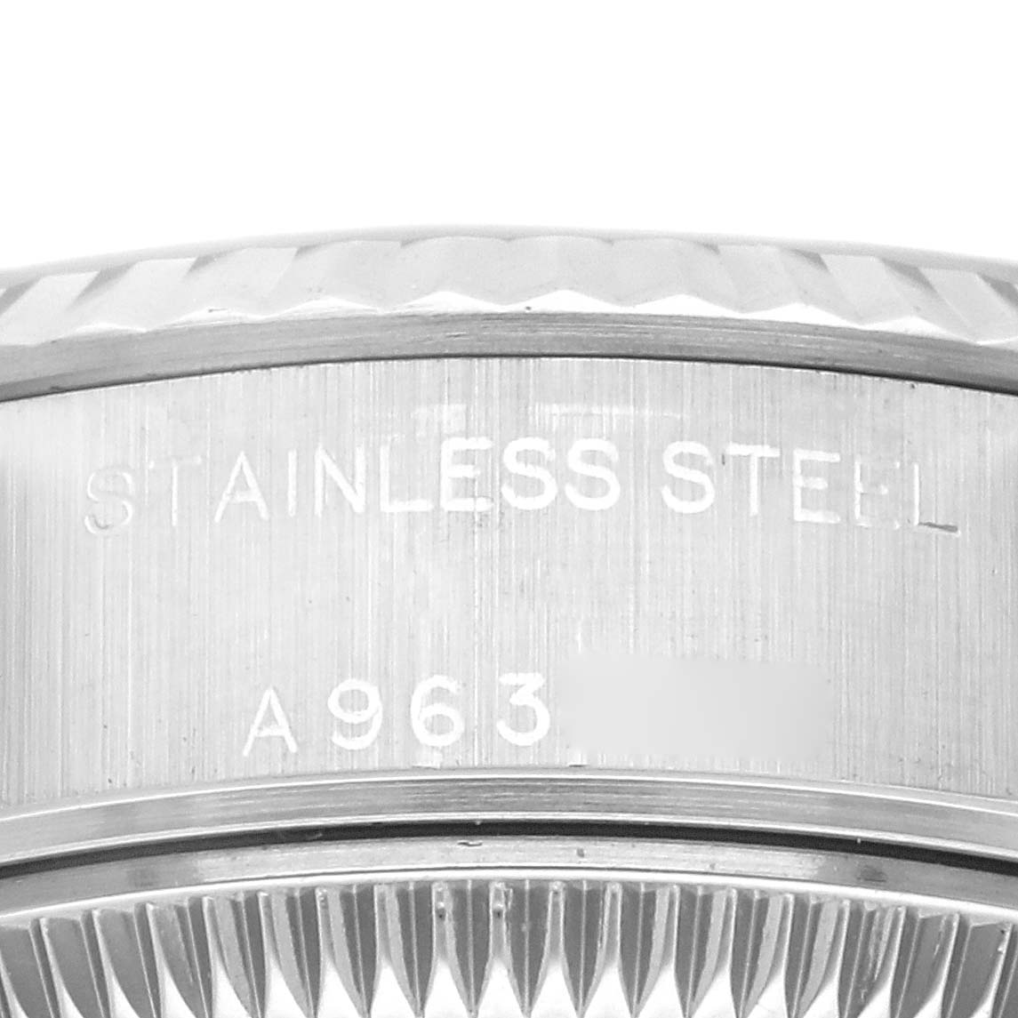 The image shows a close-up of the stainless steel casing with engraved text on a Rolex Datejust 79174 Women's Stainless Steel Silver Dial 79174 Women's Stainless Steel Silver Dial watch.
