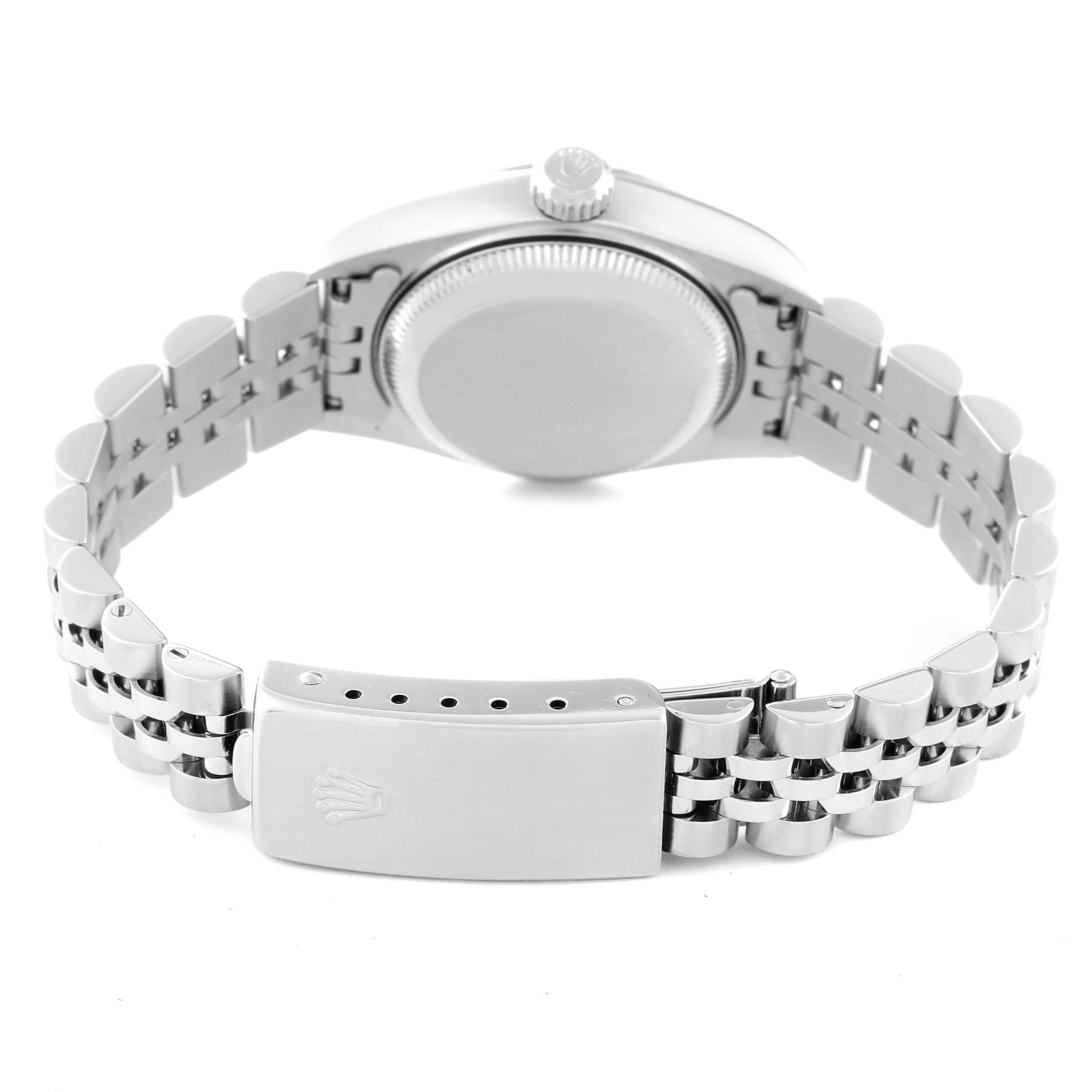 The image shows the rear view of a Rolex Datejust 79174 Women's Stainless Steel Silver Dial 79174 Women's Stainless Steel Silver Dial watch, highlighting the bracelet, clasp with logo, and case back.