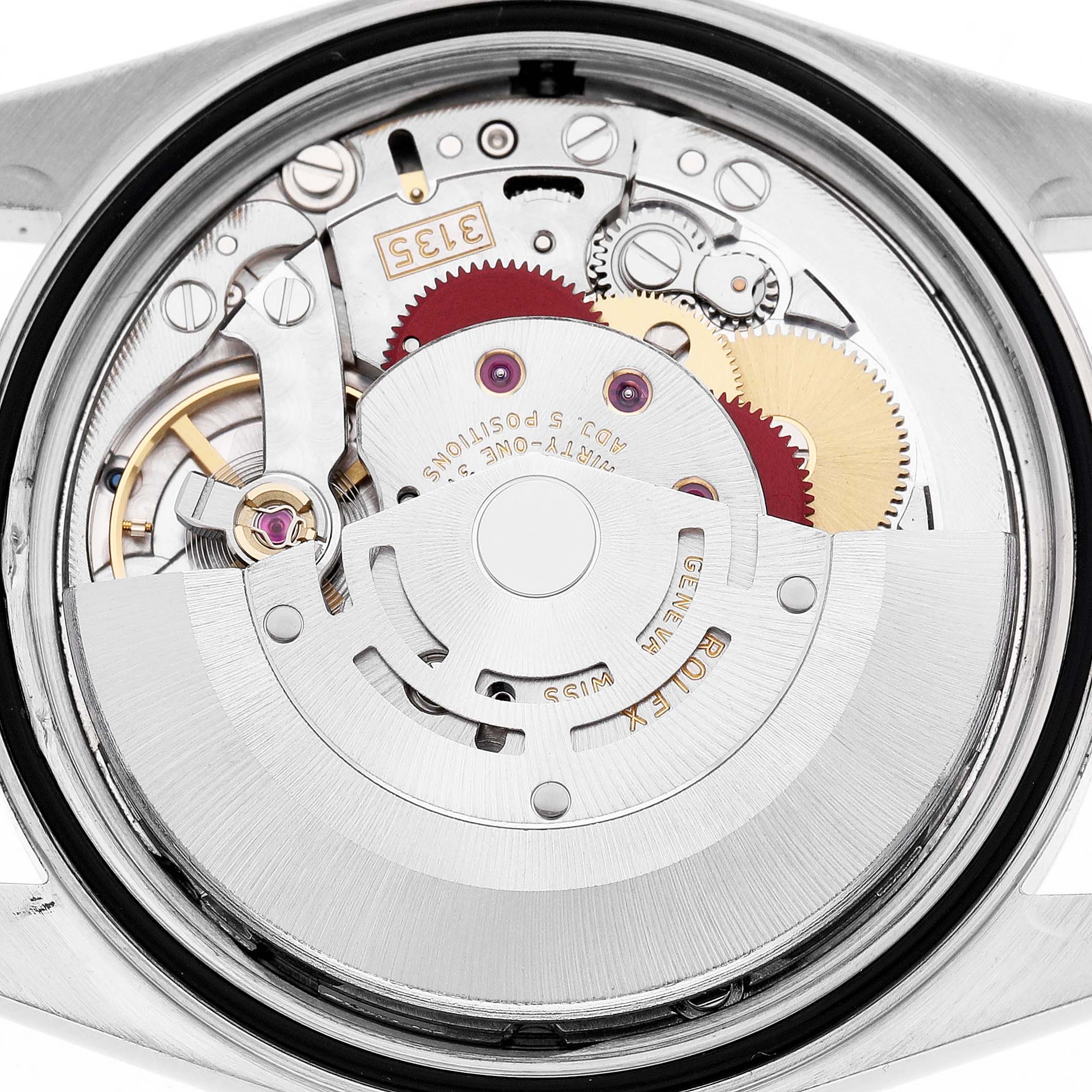 The image shows the movement interior of a Rolex Datejust 16200 Men's Stainless Steel Silver Dial, highlighting gears and components of the watch's mechanism.