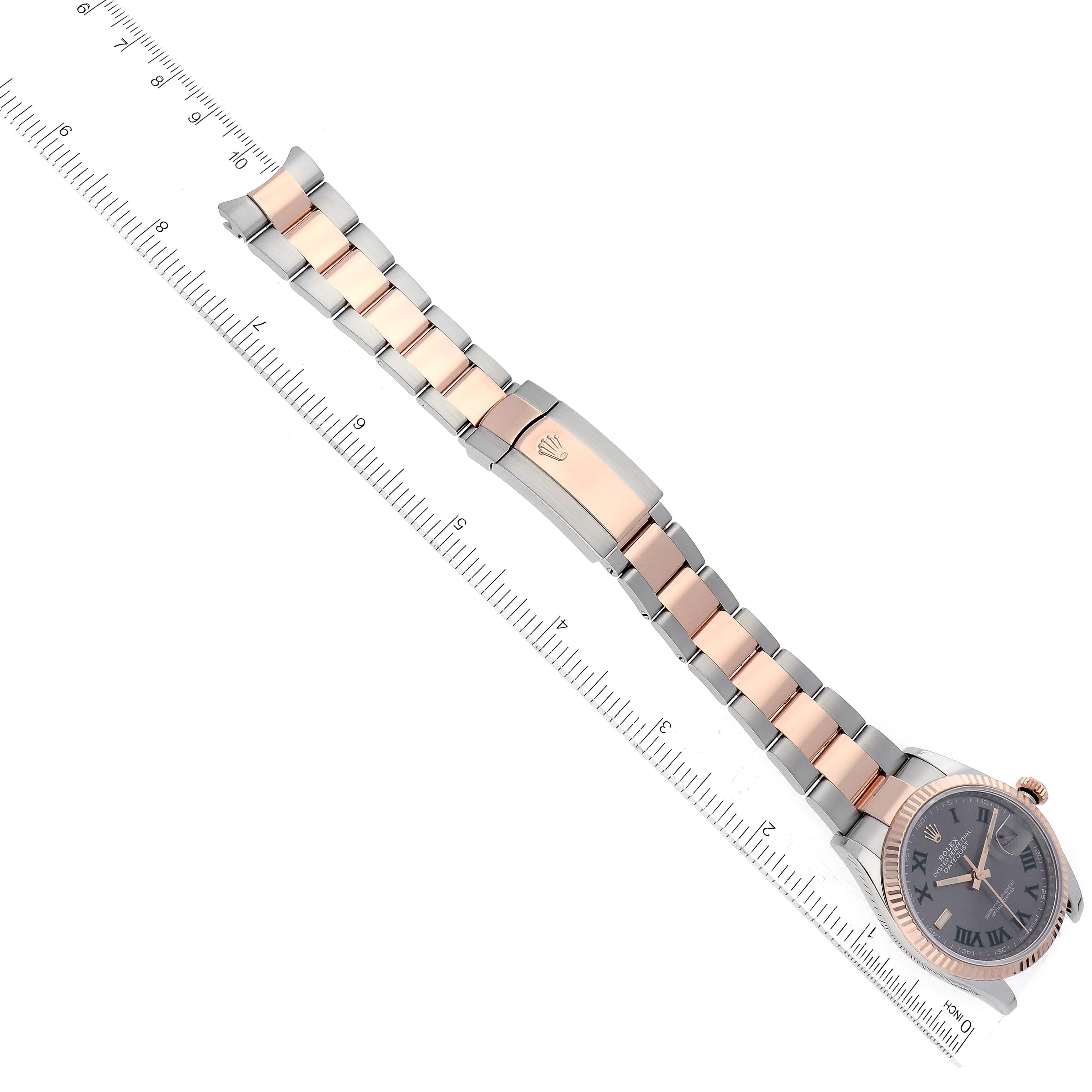 The image shows a side view of the Rolex Datejust 126231 Men's Steel and Gold (two tone) Grey Dial 126231 Men's Steel and Gold (two tone) Grey Dial watch with its bracelet stretched alongside a ruler.