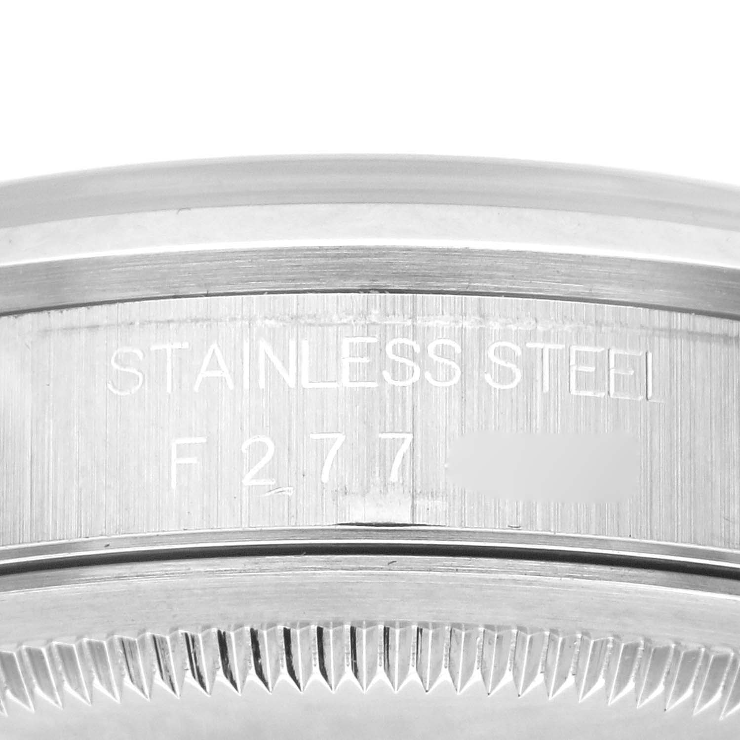 This image shows a close-up of the case side of a Rolex Datejust 16200 Men's Stainless Steel Silver Dial 16200 Men's Stainless Steel Silver Dial watch, highlighting the "STAINLESS STEEL" engraving and part of the bezel.