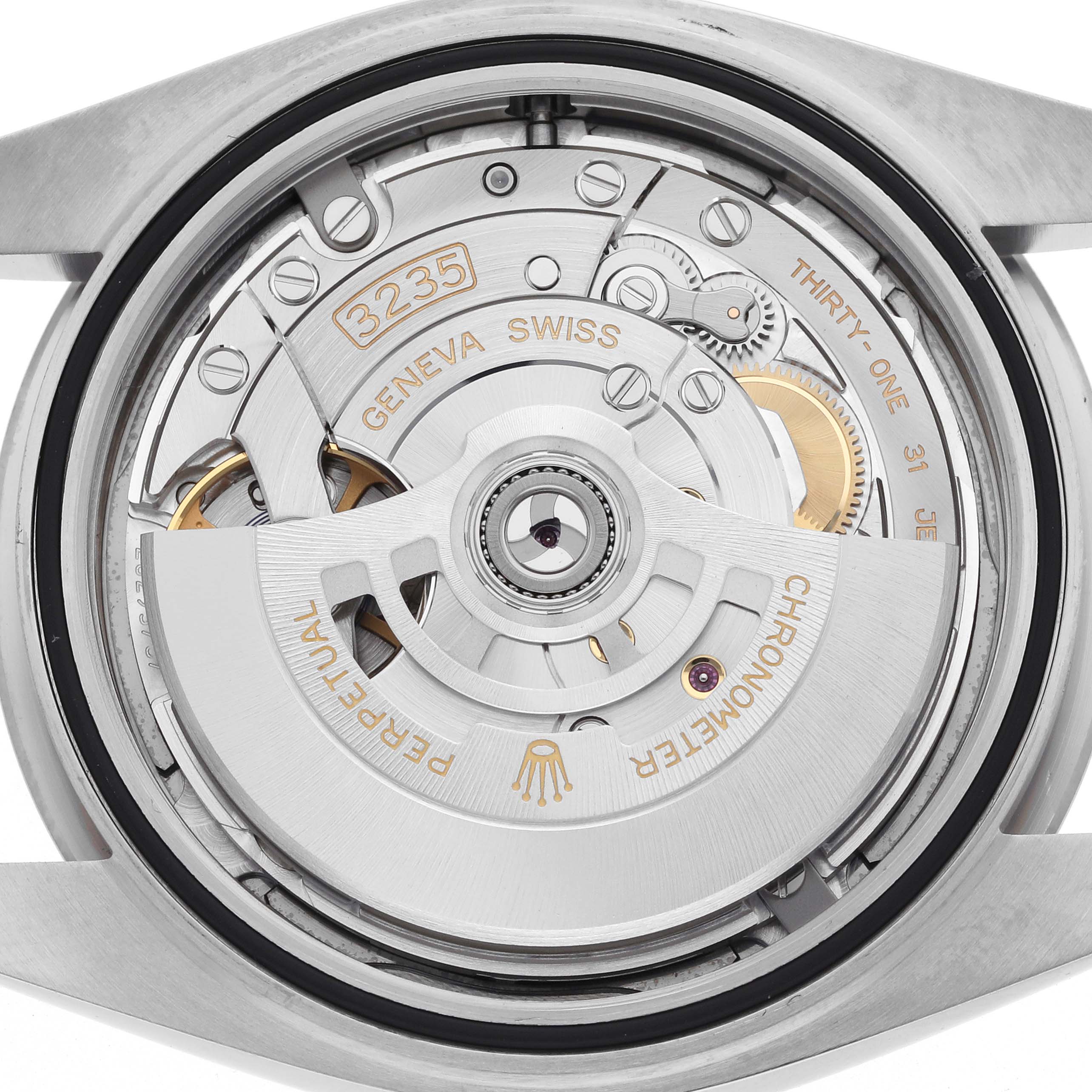 The image shows the movement of a Rolex Datejust 41 126334 Men
s Stainless Steel Grey Dial 126334 Men
s Stainless Steel Grey Dial watch from the back, highlighting the rotor and mechanical components.