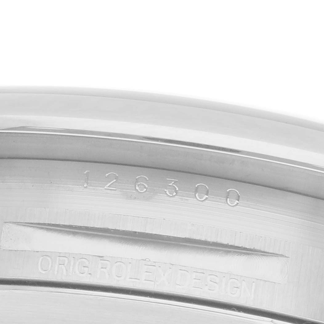 The image shows the inner bezel of a Rolex Datejust 41 126300 Men
s Stainless Steel Grey Dial 126300 Men
s Stainless Steel Grey Dial, featuring engraved numbers and the words "ORIG. ROLEX DESIGN."