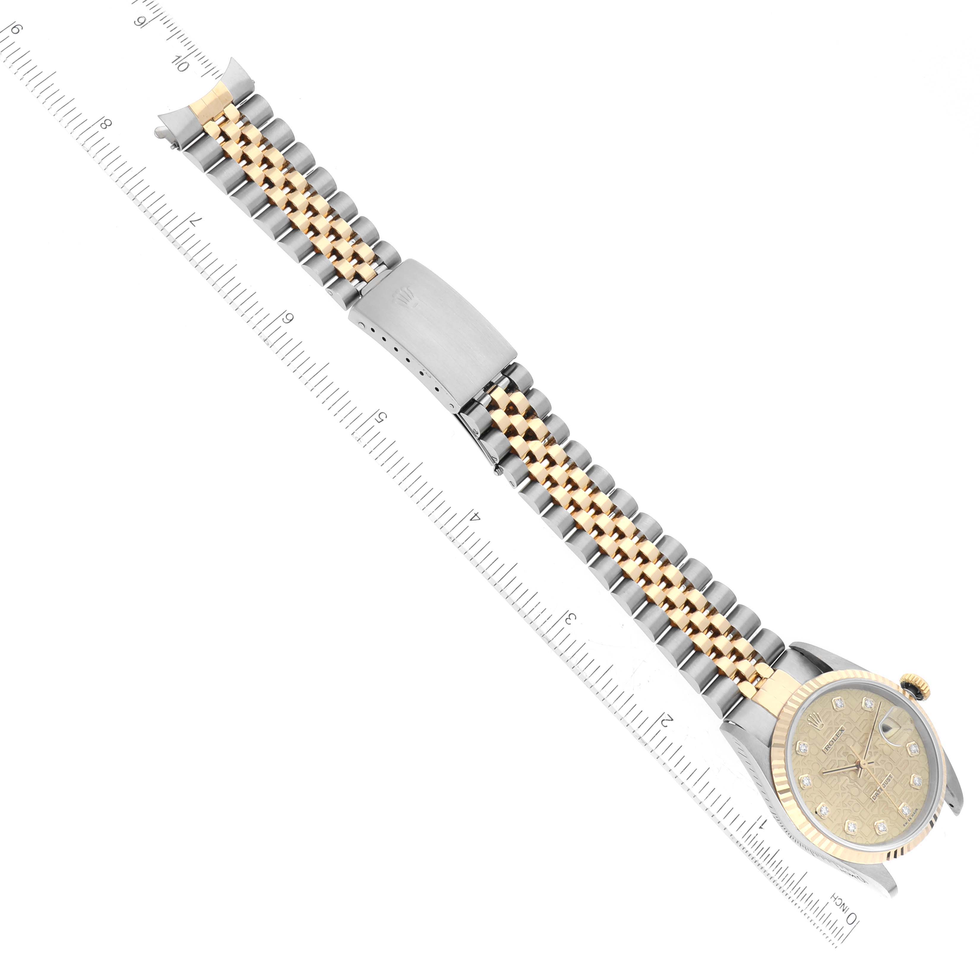 The image shows a Rolex Datejust 16233 Men's Steel and Gold (two tone) Champagne Dial 16233 Men's Steel and Gold (two tone) Champagne Dial watch laid flat with a ruler alongside to measure the length of its band.