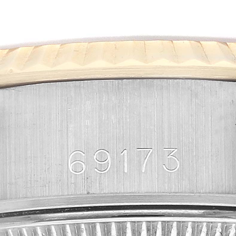 This image shows a close-up of the case side and bezel of a Rolex Datejust 69173G Women's Steel and Gold (two tone) Champagne Dial 69173G Women's Steel and Gold (two tone) Champagne Dial model, displaying the engraved model number "69173."