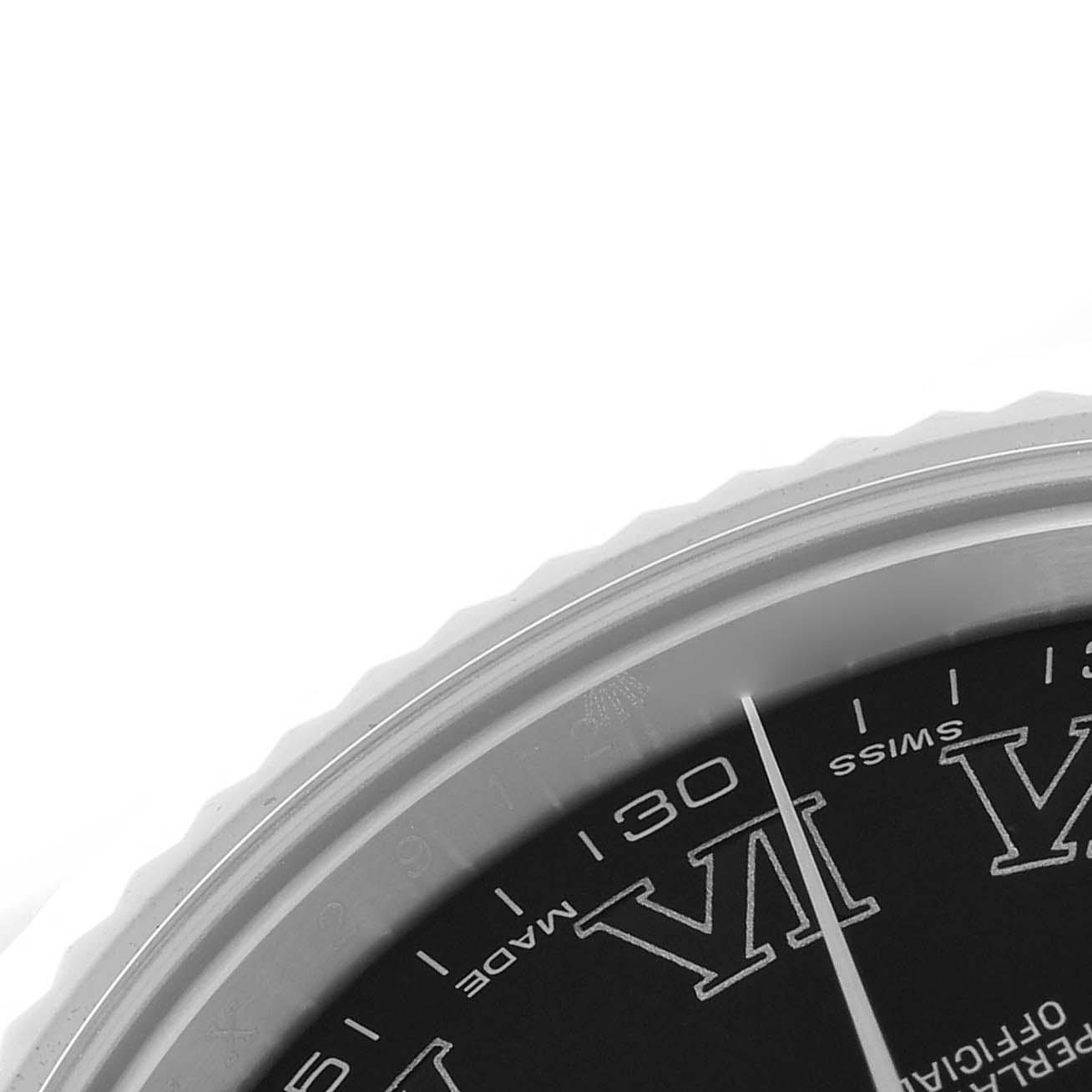 The image shows a partial view of the Rolex Datejust 41 116334 Men's Stainless Steel Grey Dial 116334 Men's Stainless Steel Grey Dial's dial and bezel, with visible Roman numerals and a slender hand.