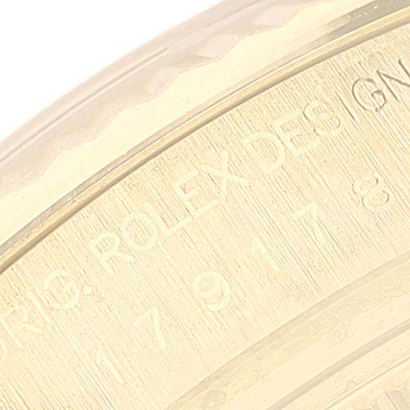This image shows a close-up angle of the engraved bezel or case detailing on a Rolex President 179178 Women
s Yellow Gold Champagne Dial 179178 Women
s Yellow Gold Champagne Dial model watch.