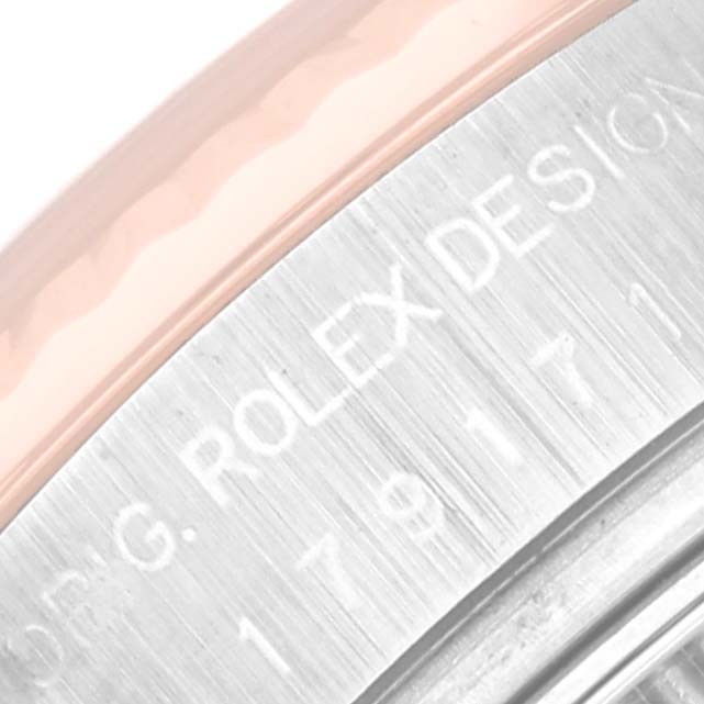 The image shows a close-up of the side of the bezel and case engraving on a Rolex Datejust 179171 Women's Steel and Gold (two tone) Silver Dial 179171 Women's Steel and Gold (two tone) Silver Dial watch.