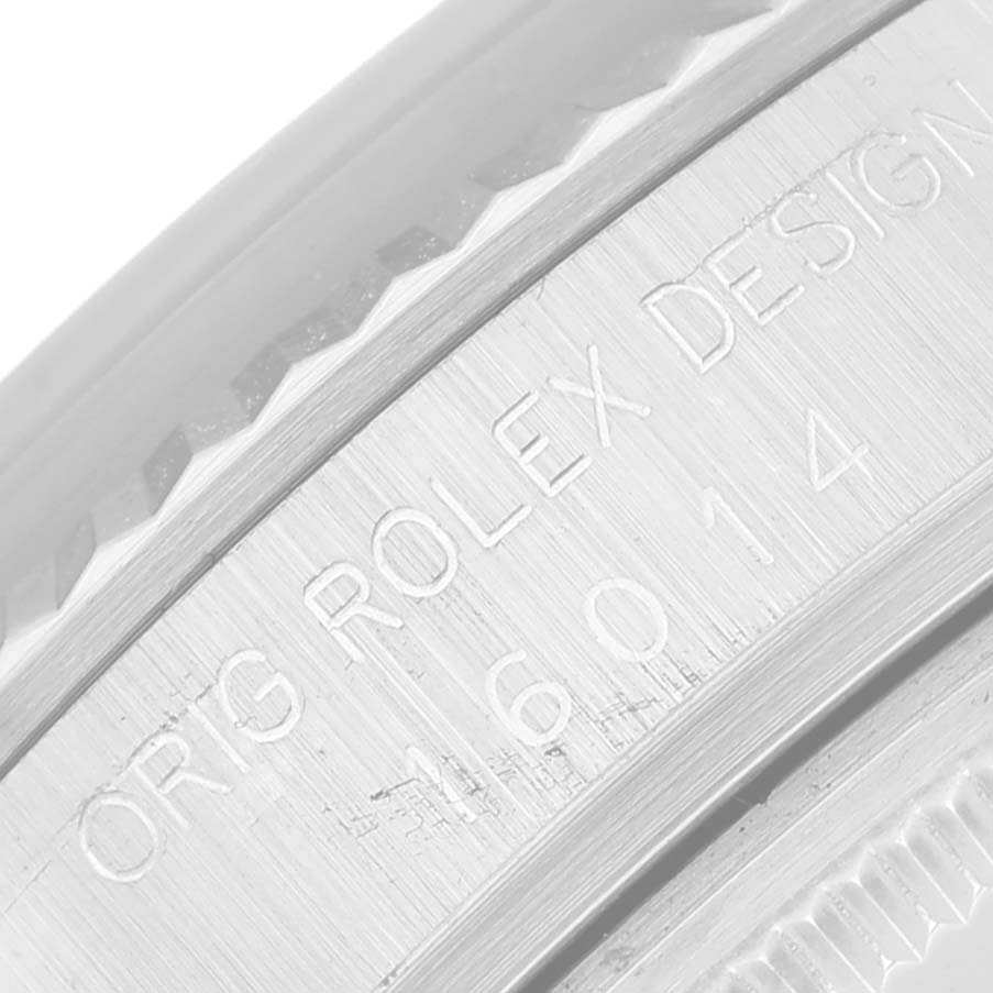This image shows a close-up angle of the engraved bezel of a Rolex Pearlmaster watch, highlighting the "ORIG ROLEX DESIGN" inscription.