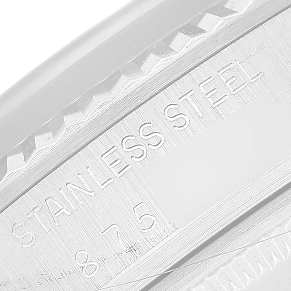 This close-up angle shows the stainless steel engraving on the case of a Rolex Pearlmaster watch.