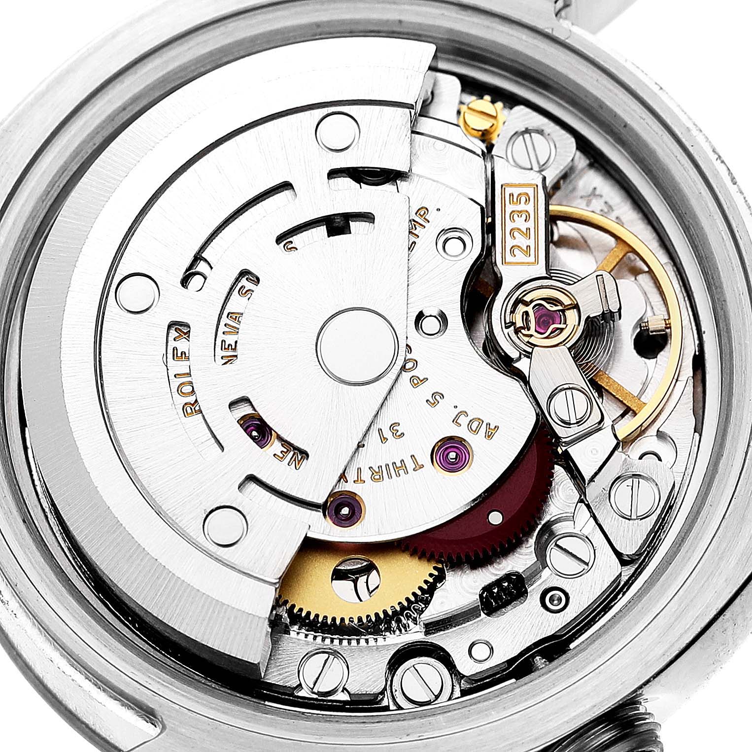 This image shows the intricate movement mechanism of a Rolex Datejust 179174 Women's Stainless Steel Pink Dial 179174 Women's Stainless Steel Pink Dial watch from a close-up, inside angle.
