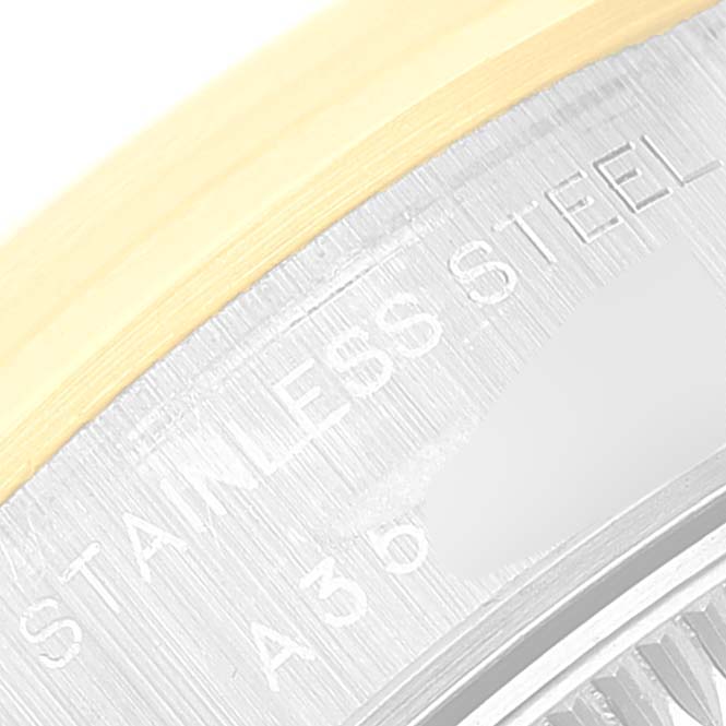 This close-up image shows the stainless steel outer edge and part of the engraving on a Rolex Datejust 79163 Women's Steel and Gold (two tone) Silver Dial 79163 Women's Steel and Gold (two tone) Silver Dial watch.