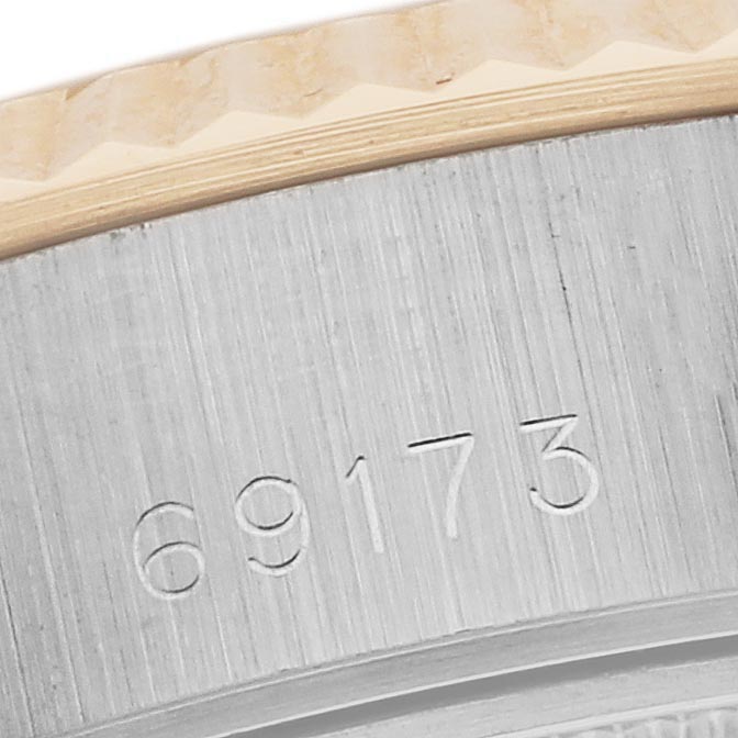 The image shows a close-up of the Rolex Datejust 69173 Women's Steel and Gold (two tone) Champagne Dial 69173 Women's Steel and Gold (two tone) Champagne Dial's side, highlighting the model number and fluted bezel.