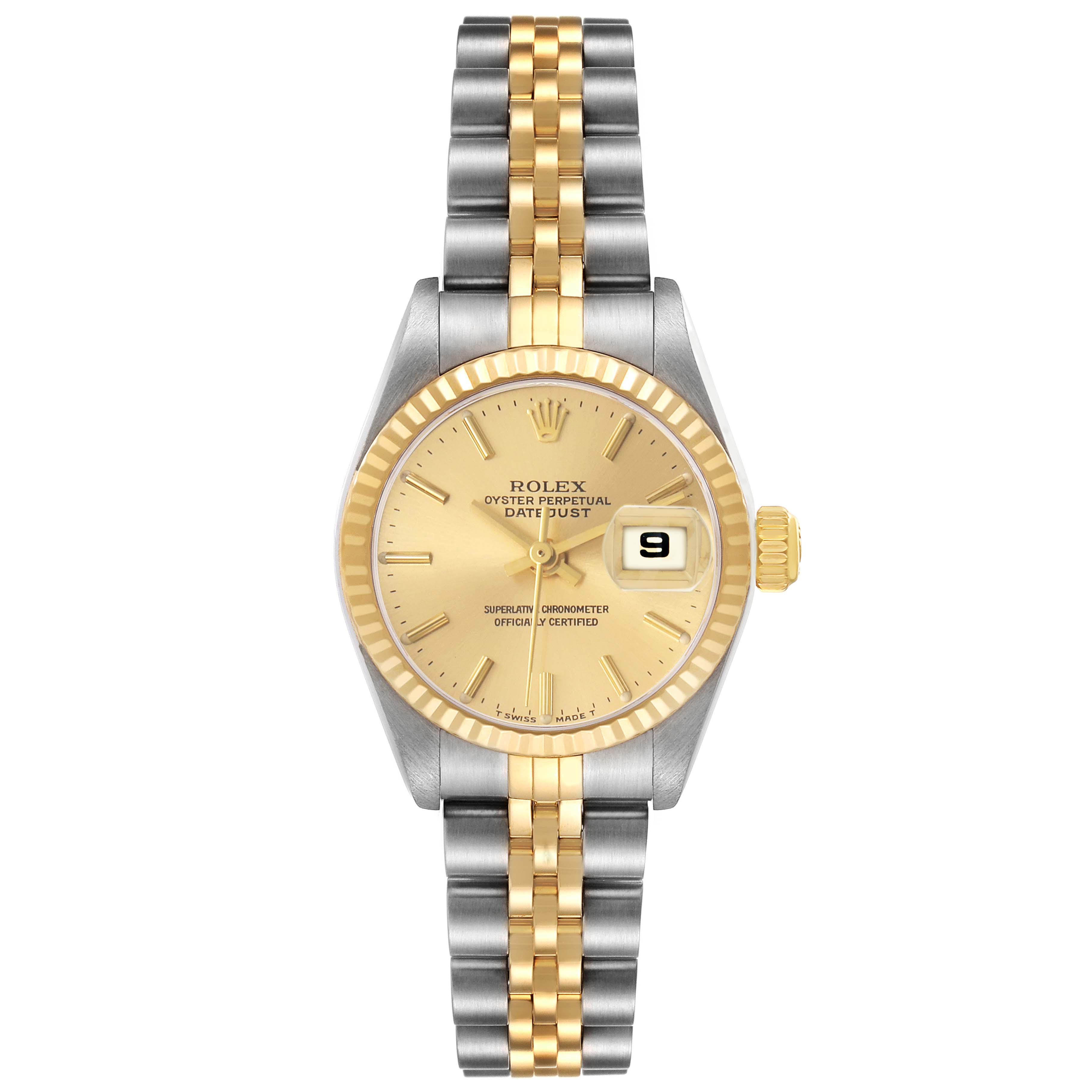 The Rolex Datejust 79173 Women's Steel and Gold (two tone) Champagne Dial watch is shown from a top-down angle, displaying its golden dial, fluted bezel, and two-tone bracelet.