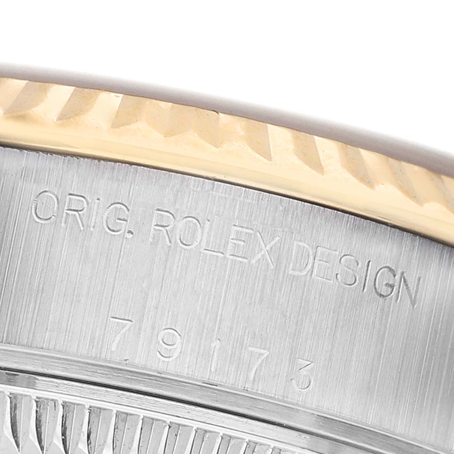 The image shows a close-up of the Rolex Datejust 79173 Women's Steel and Gold (two tone) Champagne Dial's case side with model number engraving.