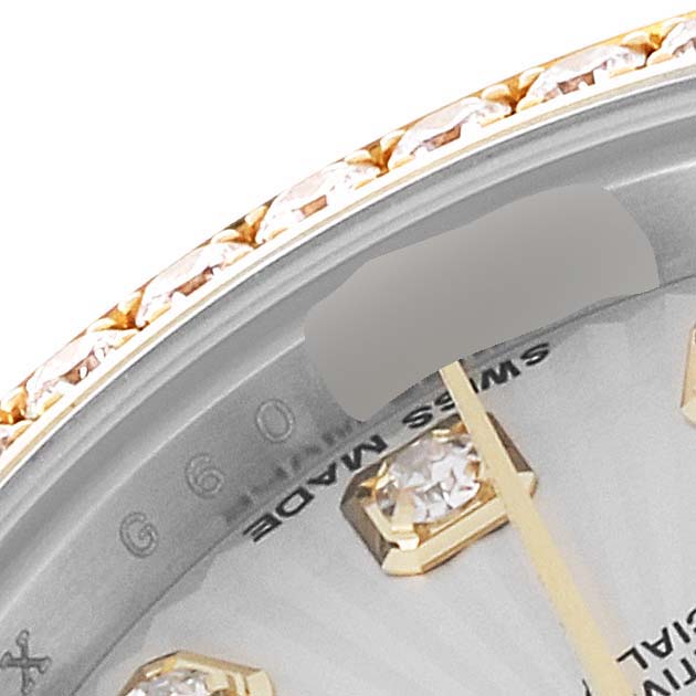 This image shows a close-up angle of the dial and diamond markers of a Rolex Datejust 179383 Women's Steel and Gold (two tone) Silver Dial 179383 Women's Steel and Gold (two tone) Silver Dial watch, including part of the bezel.