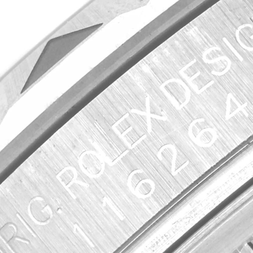 The image shows a macro shot of the bezel and engraved text on the side of a Rolex Turn-o-Graph 116264 Men's Stainless Steel Black Dial 116264 Men's Stainless Steel Black Dial watch case.