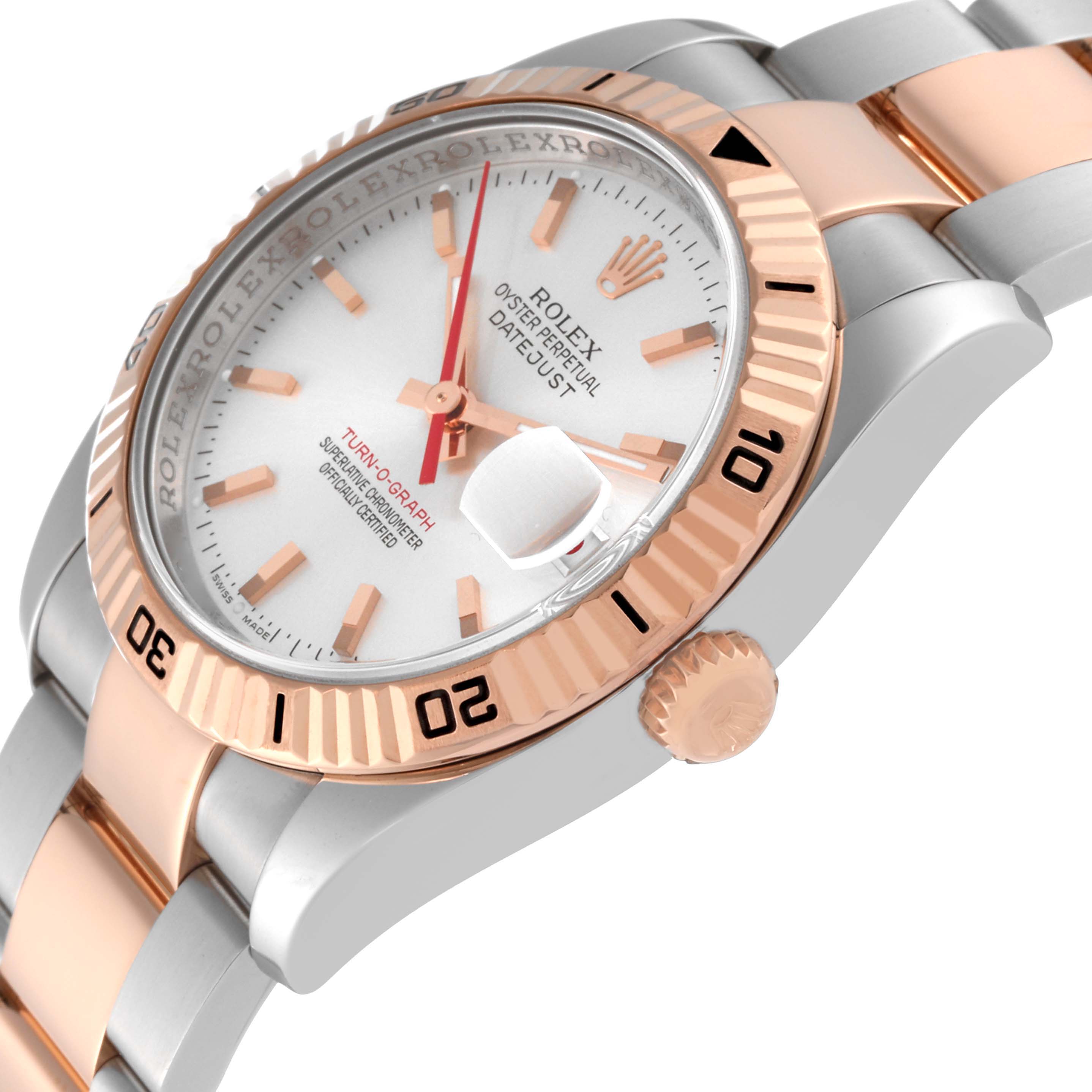 This image shows the face, bezel, and part of the band of a Rolex Turn-o-Graph 116261 Men's Steel and Gold (two tone) Silver Dial 116261 Men's Steel and Gold (two tone) Silver Dial watch from an angled side view.