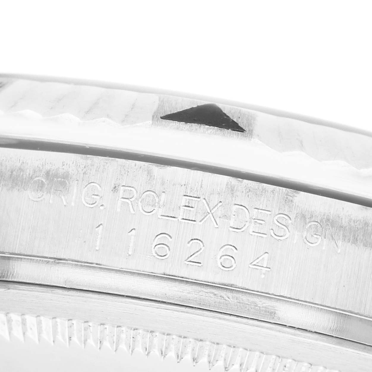 The image shows a close-up side view of the bezel and engraved model number on a Rolex Turn-o-Graph 116264 Men's Stainless Steel Blue Dial watch.