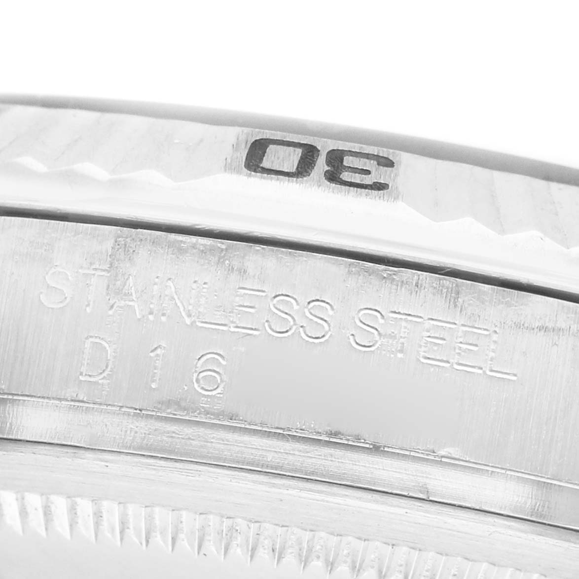The image shows a close-up angle of the Rolex Turn-o-Graph 116264 Men's Stainless Steel Blue Dial's stainless steel bezel with engraved numbers.