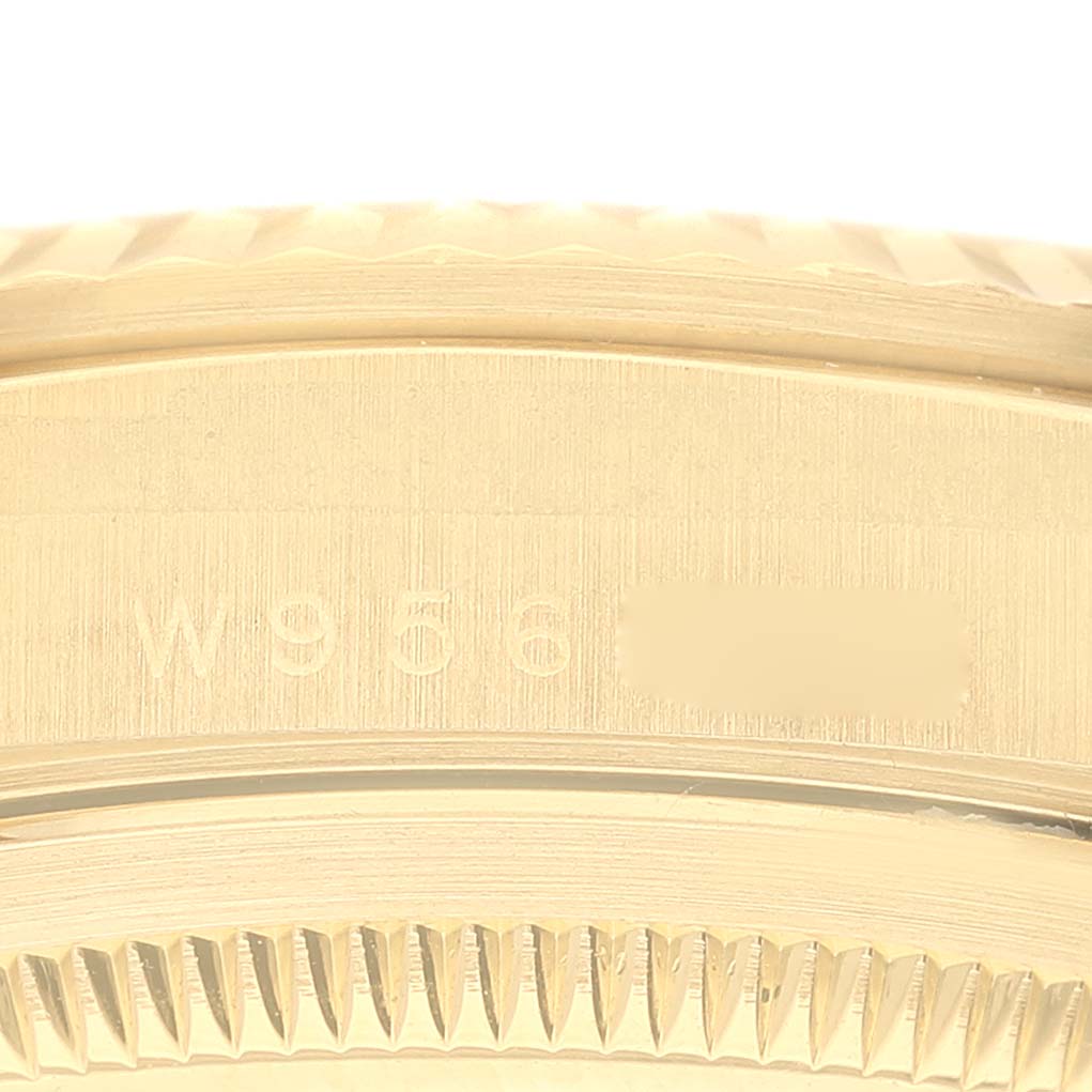 This close-up image shows the serial number engraving on the case side of a Rolex President 18238 Men
s Yellow Gold Champagne Dial 18238 Men
s Yellow Gold Champagne Dial model watch.