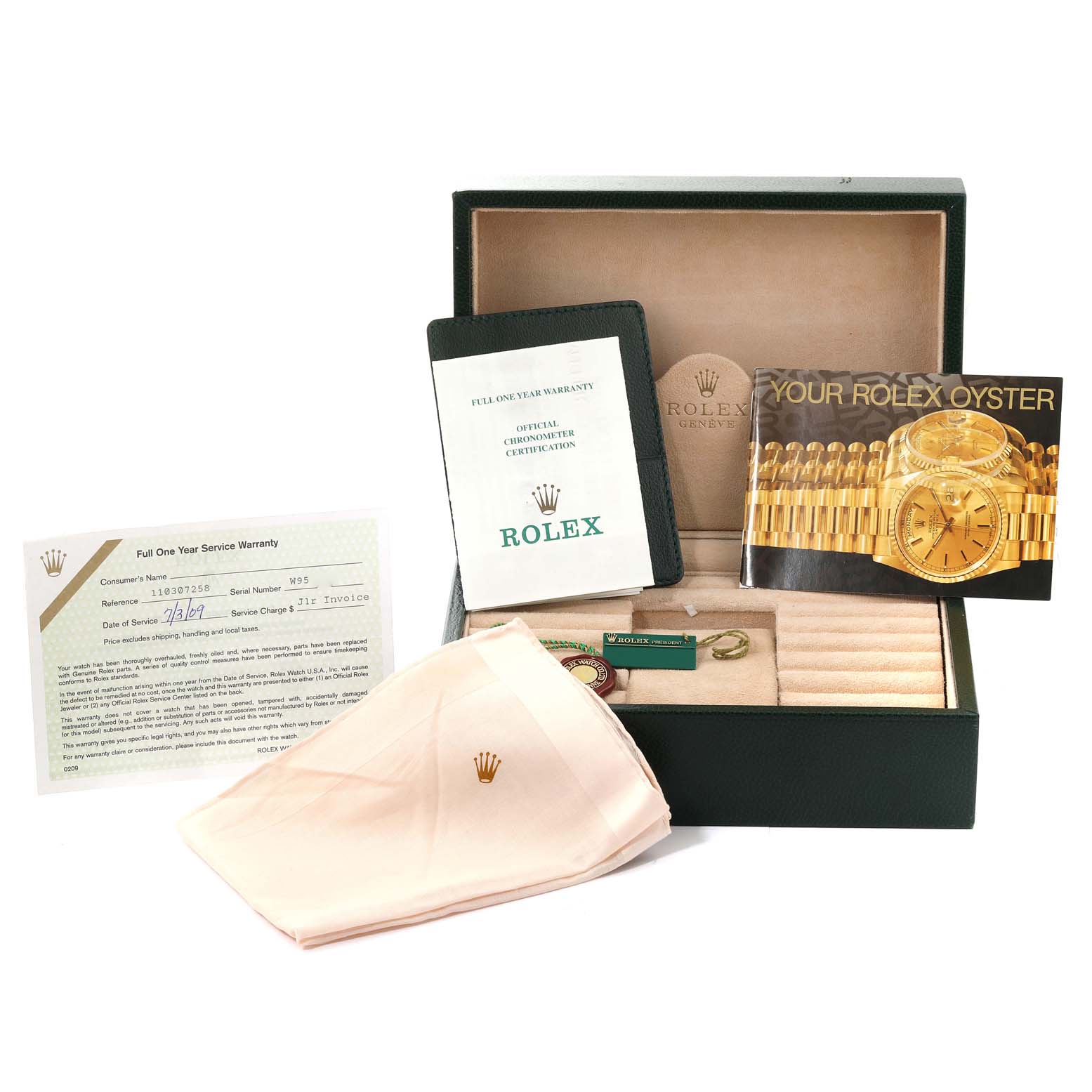 This image shows the accessories of the Rolex President 18238 Men
s Yellow Gold Champagne Dial 18238 Men
s Yellow Gold Champagne Dial model, including its box, warranty card, manual, and a polishing cloth.