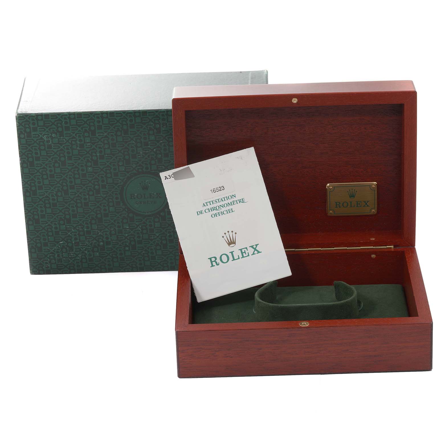 Displayed are the open wooden box, green interior cushion, and paperwork for a Rolex Daytona 16523 Men's Steel and Gold (two tone) Champagne Dial 16523 Men's Steel and Gold (two tone) Champagne Dial watch, along with its outer box.