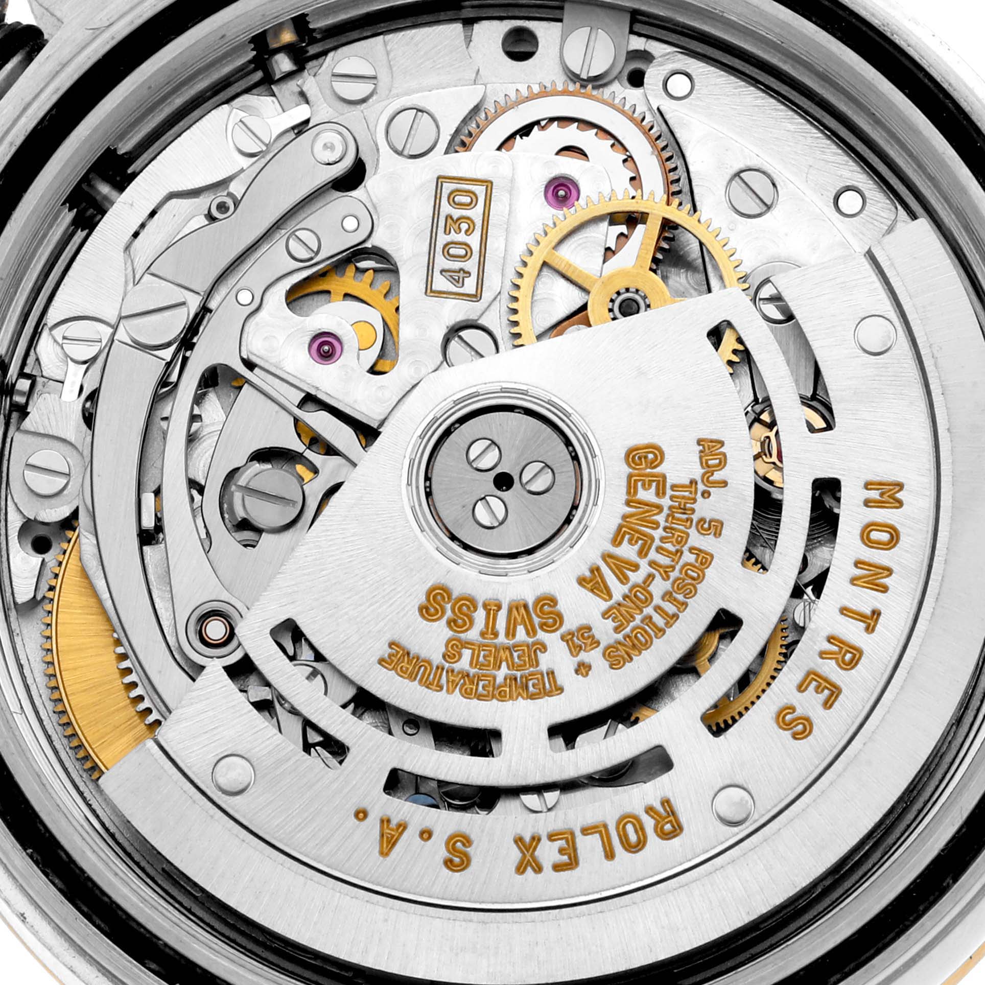 This image shows the detailed internal mechanism of a Rolex Daytona 16523 Men's Steel and Gold (two tone) Champagne Dial 16523 Men's Steel and Gold (two tone) Champagne Dial watch, focusing on its gears and inscriptions.