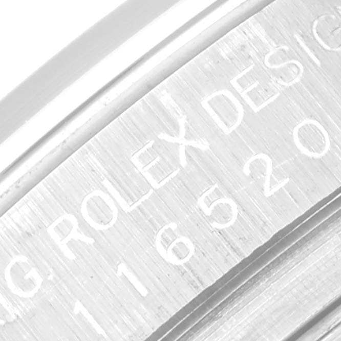 The image shows a close-up of the engraved inner case of a Rolex Daytona 116520 Men's Stainless Steel White Dial 116520 Men's Stainless Steel White Dial watch.